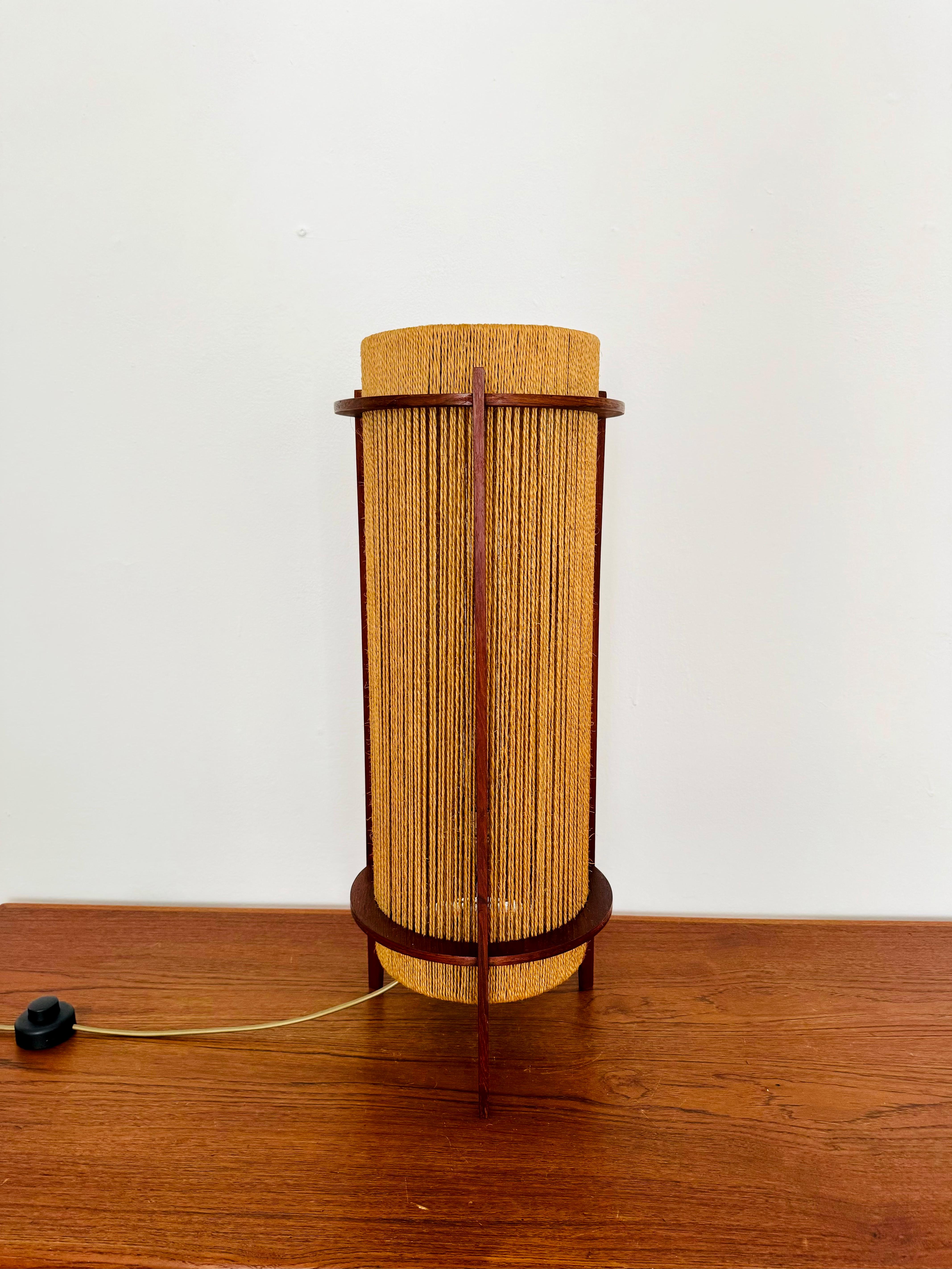 Exceptionally beautiful and very rare table or floor lamp from the 1960s.
The design is very unusual.
The shape and materials create a warm and very pleasant light.

Condition:

Very good vintage condition with slight signs of wear and tear due to