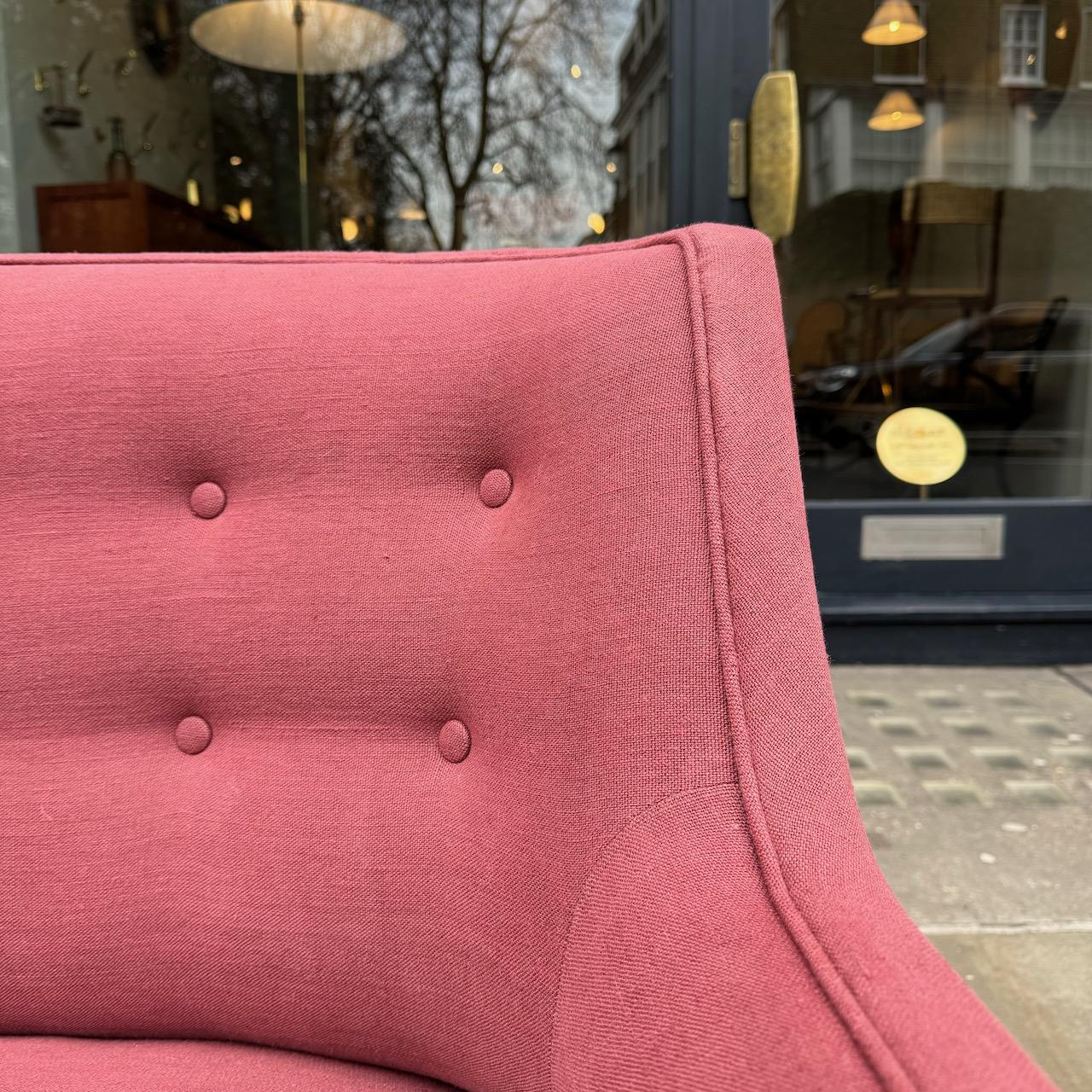 A welcoming four-seater sofa, likely to have been made in Denmark during the late 1940s or early 1950s. 

This long, yet deceptively slim, sofa has recently been reupholstered in soft, rose-coloured cotton. The muted, floral toned fabric has a