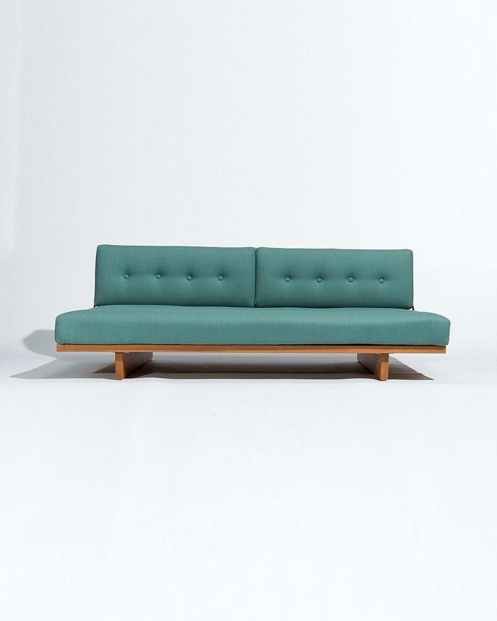 
A Danish sofa bed in oak designed by Borge Mogensen for Fredericia Stolefabrik in the 1950s. An iconic design by one of the preeminent designers of the period this piece is a low sofa that doubles up as a bed, designed for practical modern living