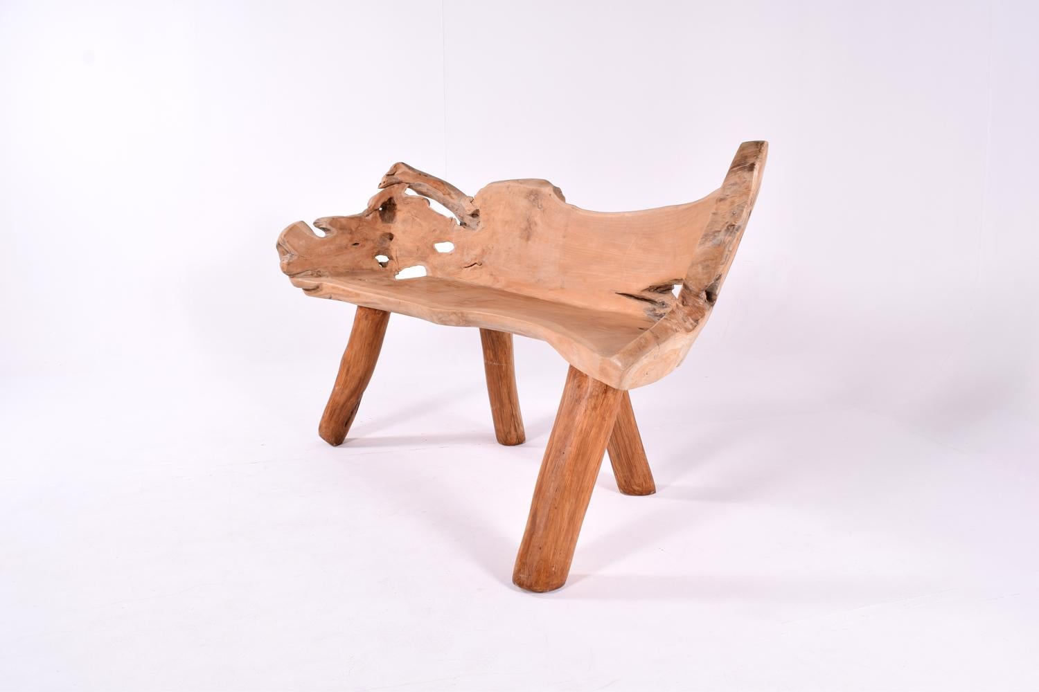 Solid polished teak root bench, natural formed shape, with carving work. Organic, elegant and solid shape, reflecting all the originality of nature itself. Very stable construction. 
Round solid feet, a great connection to the upper solid organic