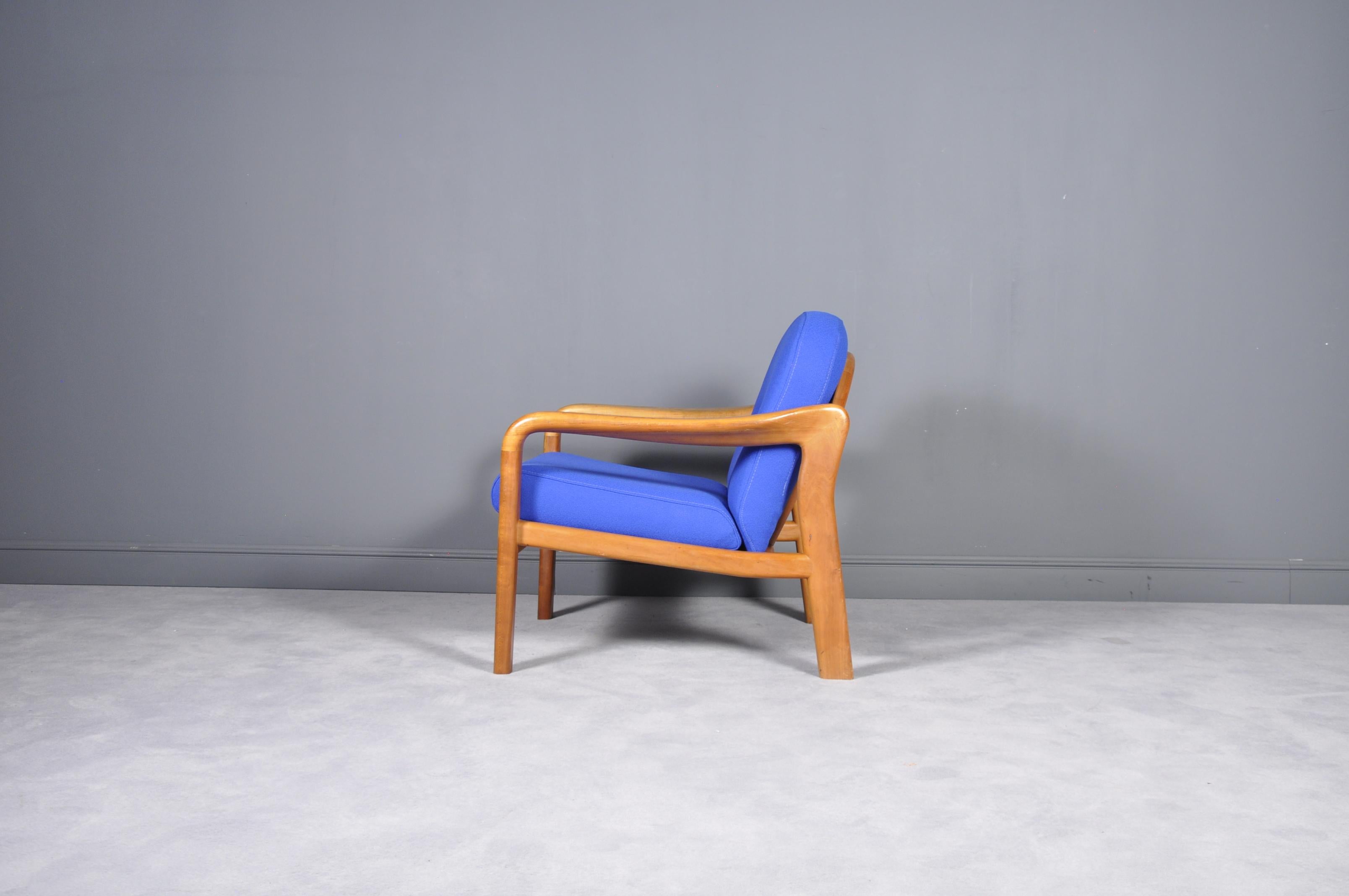 A beautiful and top quality solid teak dining chair, this was made in Denmark by Komfort. It dates from the 1960s-1970s, and in in excellent condition for its age.
The armchair was recently upholstered with indigo blue fabric.