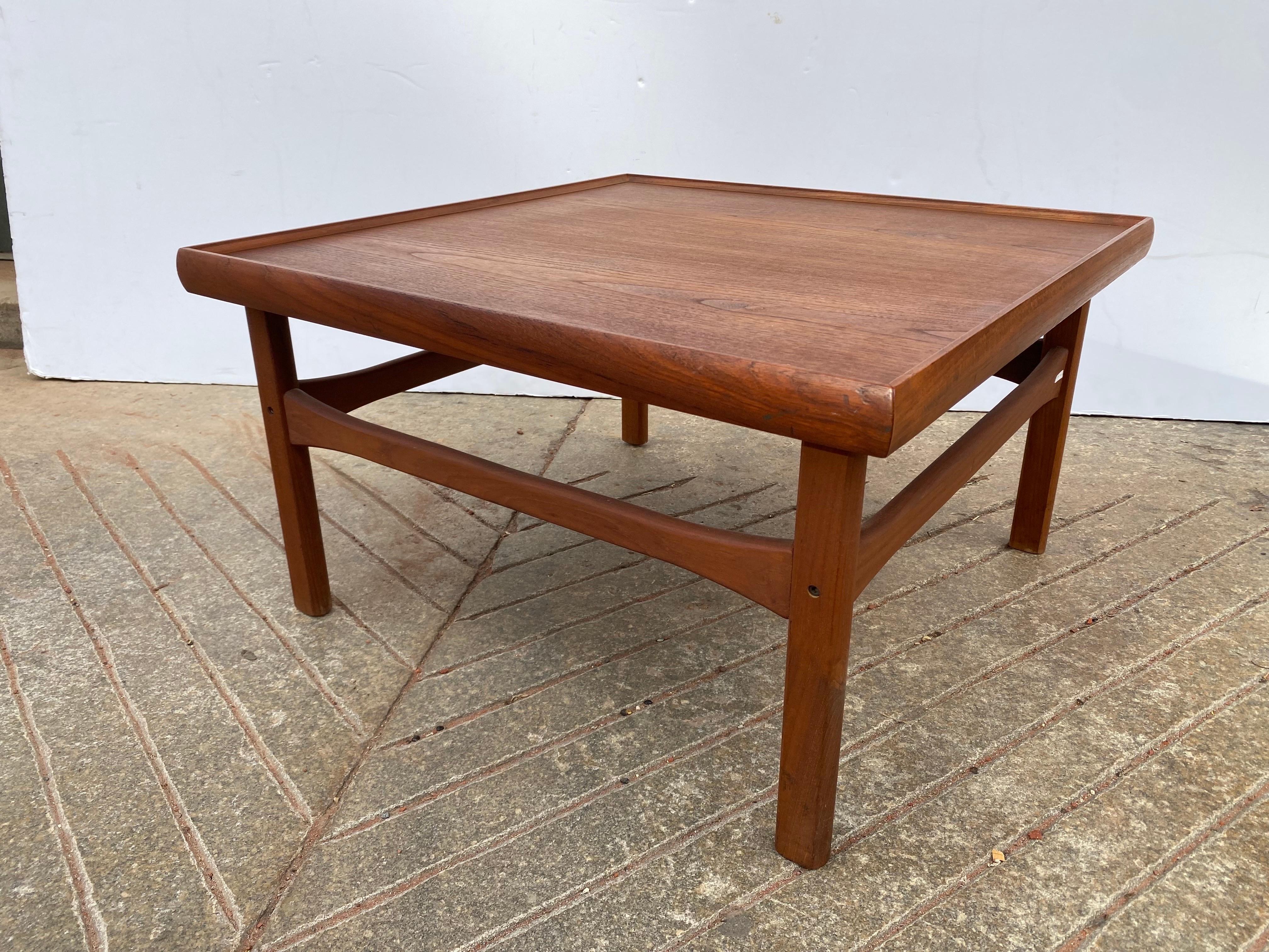 Square Teak Coffee Table in very nice original condition.  Bought from a moreddi Sales Rep with several other pieces from this company, guessing this might be from them as well.  nice Size and Scale.  Rolled lip all around perfect to catch items