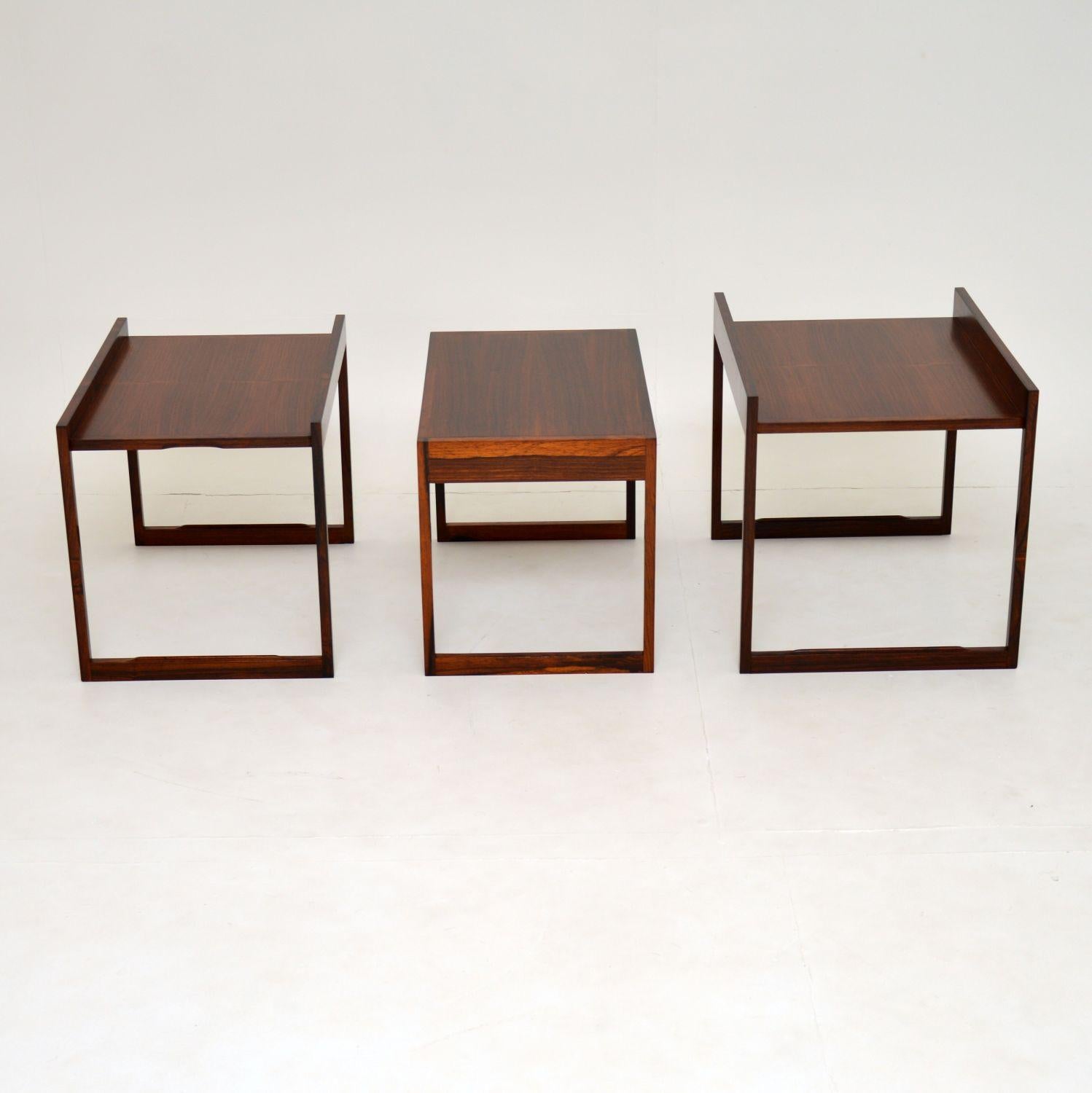 A very rare and unusual vintage Danish nest of tables. These were made in Denmark and date from the 1960s. They were most likely designed by Illum Wikkelso, they have an amazing design and are of superb quality.

The tables stack on top of each