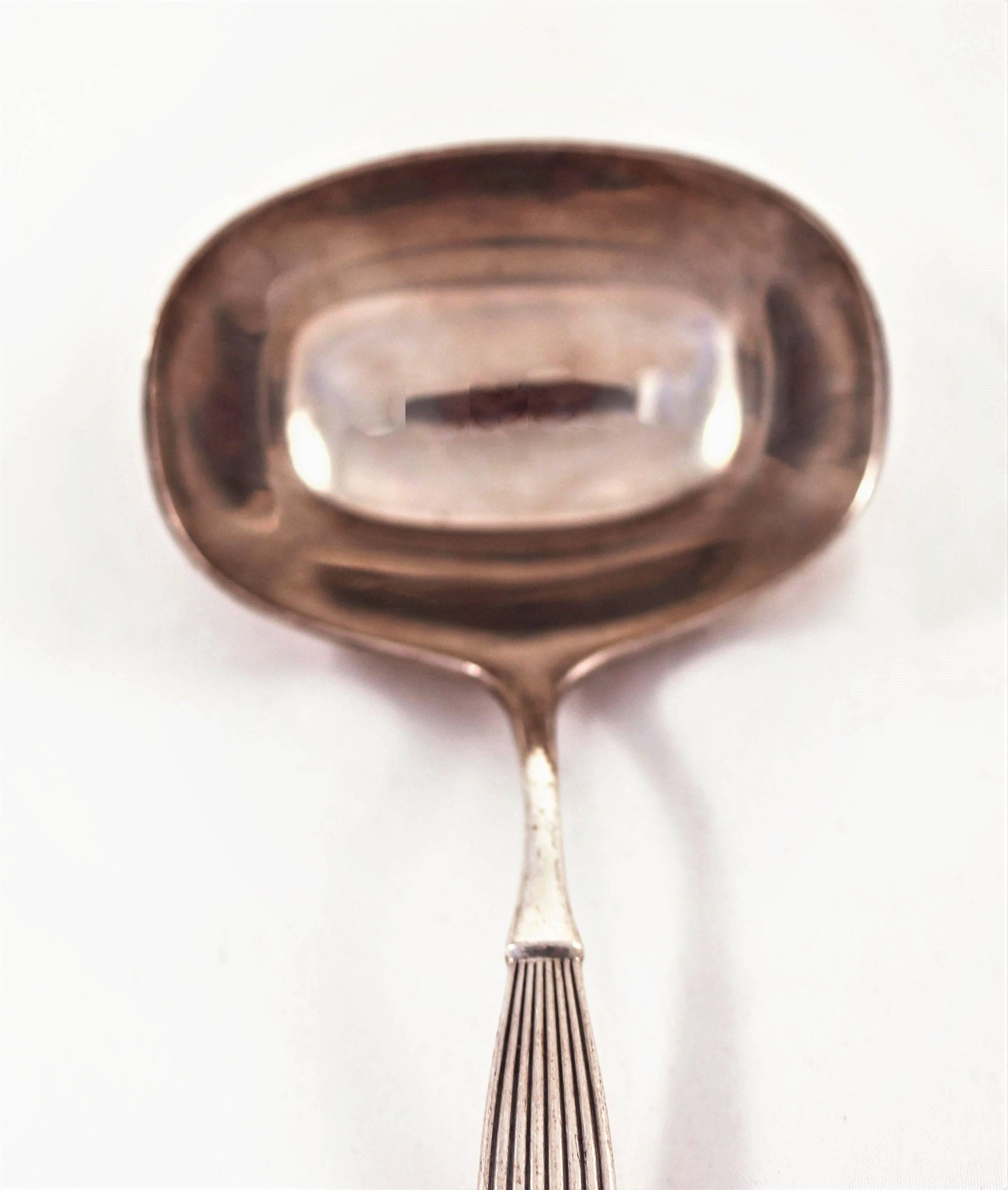 Frigast was a renowned Danish silver manufacturer. Here we have a lovely midcentury gravy ladle with ridges along the handle. It has that understated Scandinavian chicness that was so popular in the 1950s and 1960s.