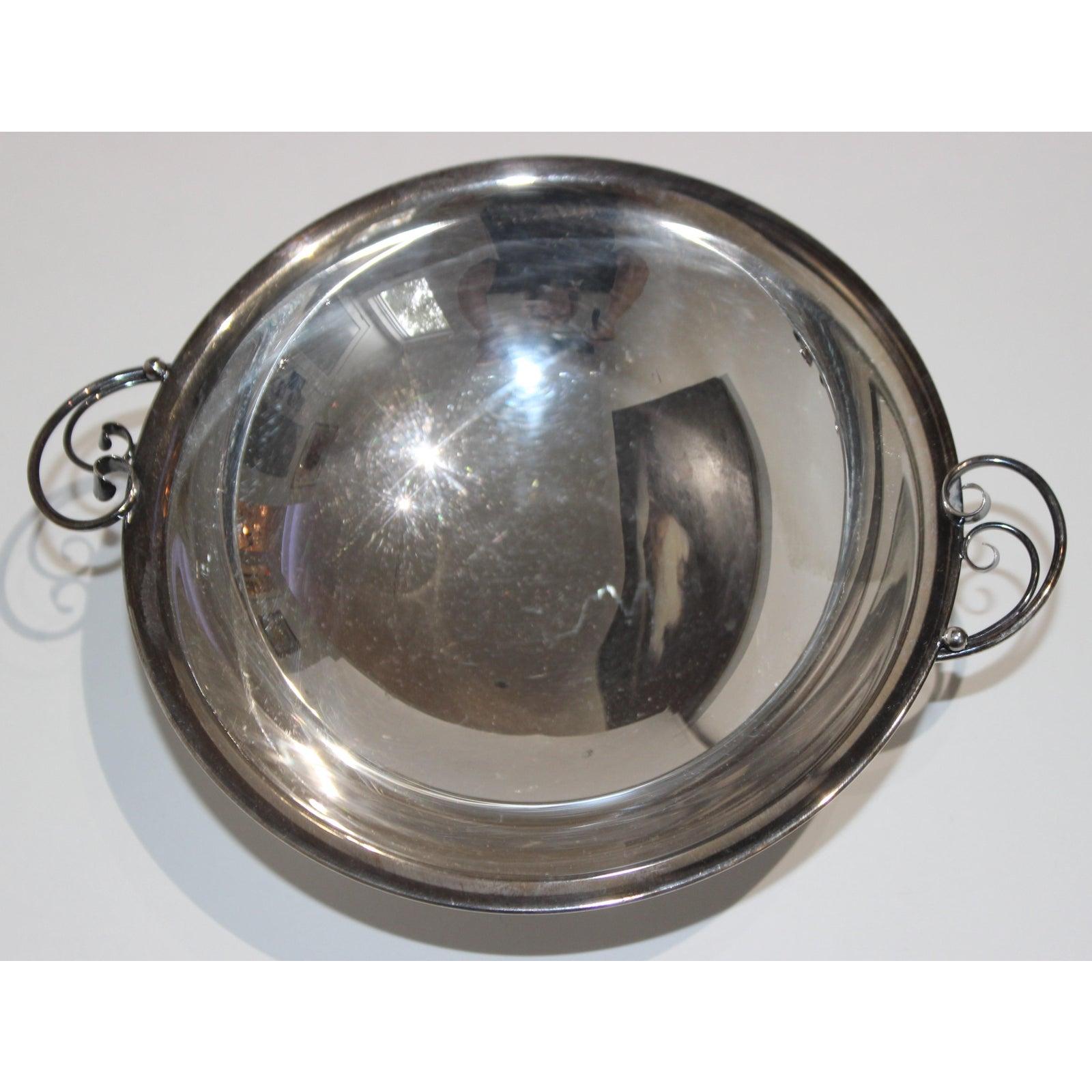 This stylish Mid-Century Modern sterling silver dish was very much inspired by pieces created by Georg Jensen. The size is perfect for serving nuts and sliced fruits. 

Note: Stamped on the verso a crown over two C's, Sterling, 925S and Denmark