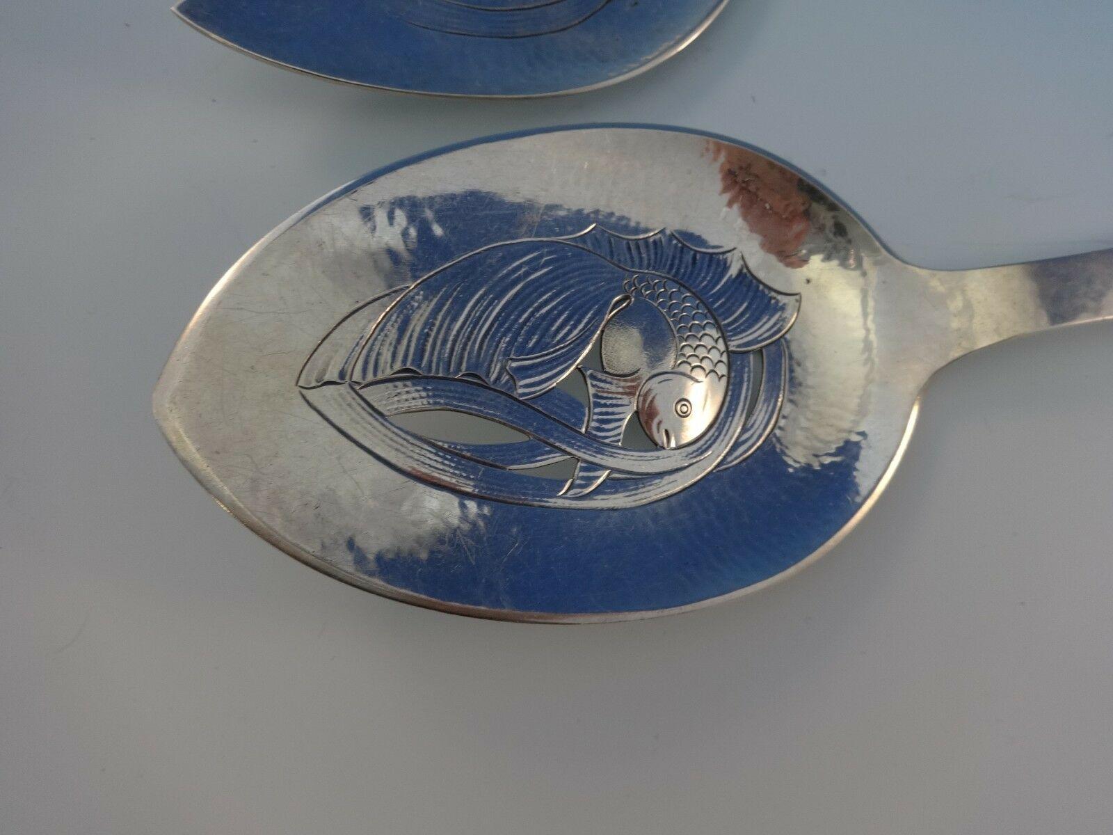 Danish Moderne handmade 826 silver fish serving set with fish 2 piece dated 1937. (Maker is unknown.) It is not monogrammed and is in excellent condition. Fabulous detailing & hand hammering. Reminiscent of Georg Jensen silver - exceptional quality.