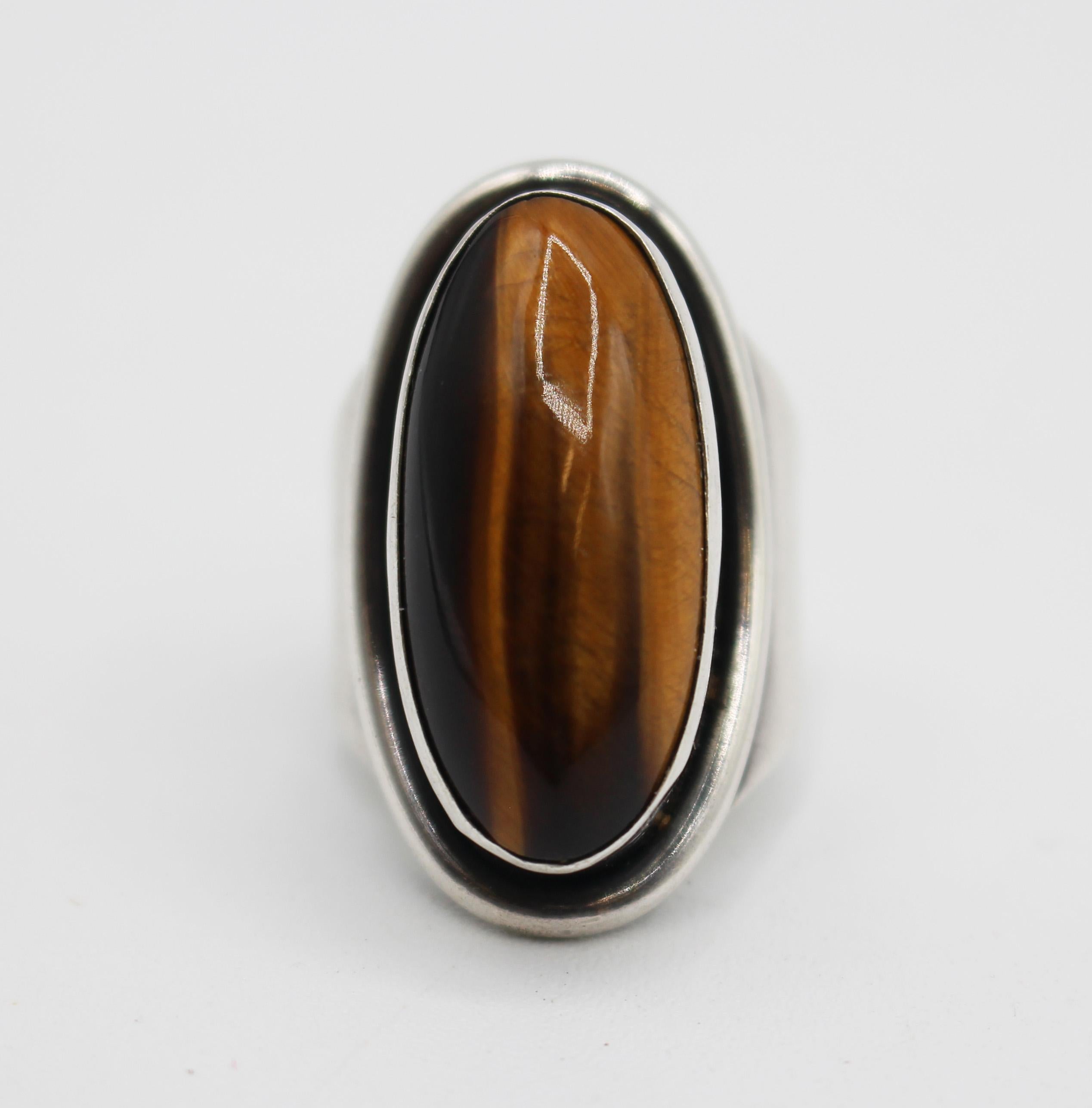 Danish circa 1950s sterling & tiger eye ring by Carl Ove Fydensburg. Bold Art Modern style. Marked: COF, Denmark, 925S. Hand made. Large, fine stone. 12 grams. Size 6.5.