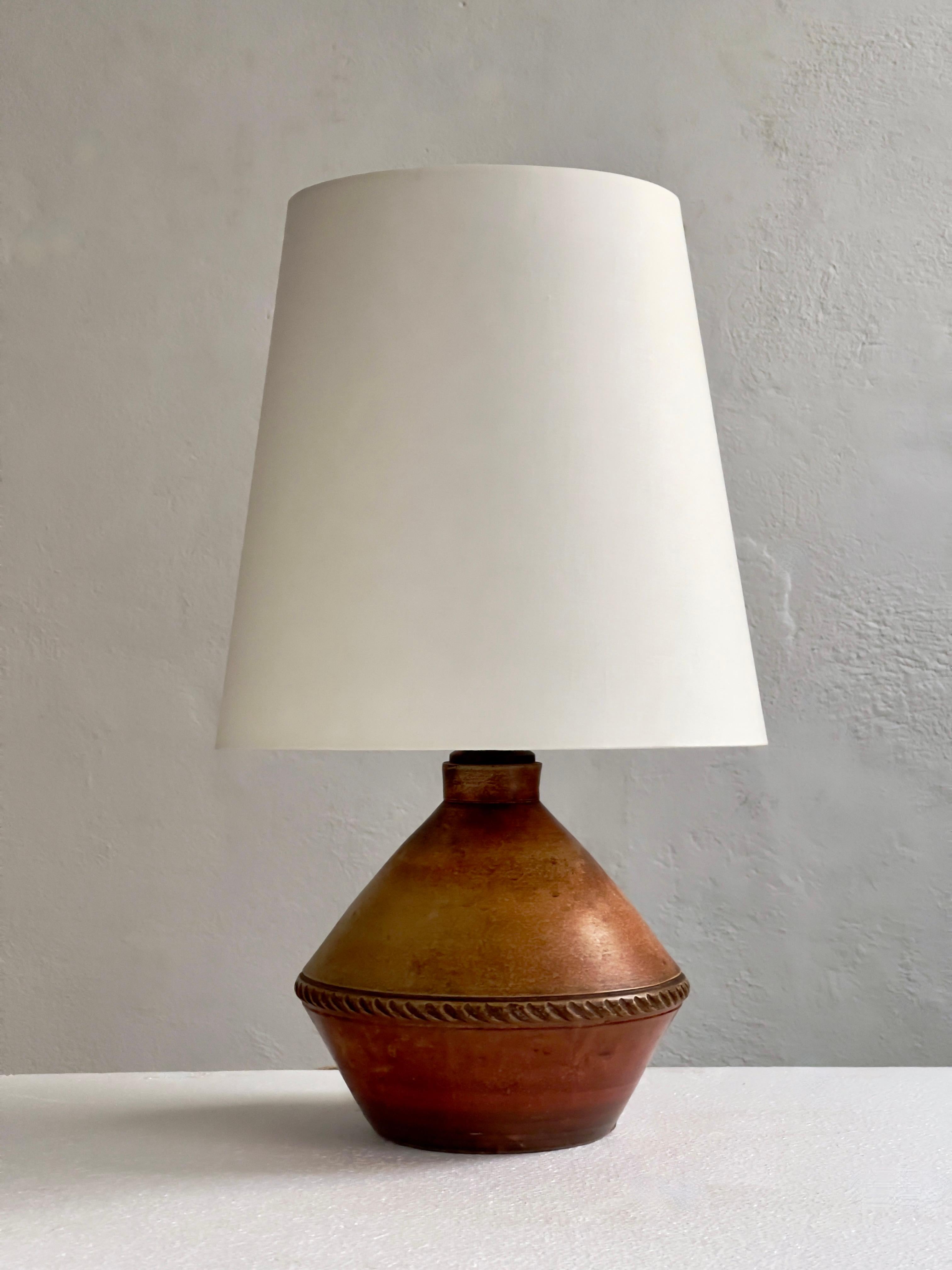 Glazed Danish stoneware table lamp with an earthy red brown glaze. Denmark 1930s For Sale