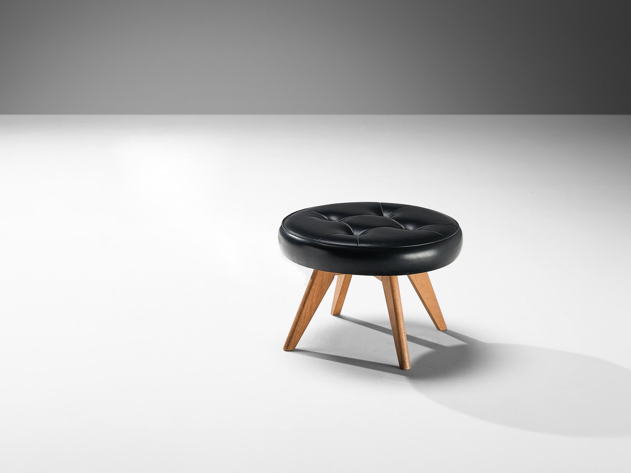 Stool, teak, leatherette, Denmark, 1960s

A sleek stool made in Denmark in the 1960s. This midcentury modern design is a wonderful addition to any interior, due to its minimalist aesthetic. The stool is equipped with a round, tufted cushion,