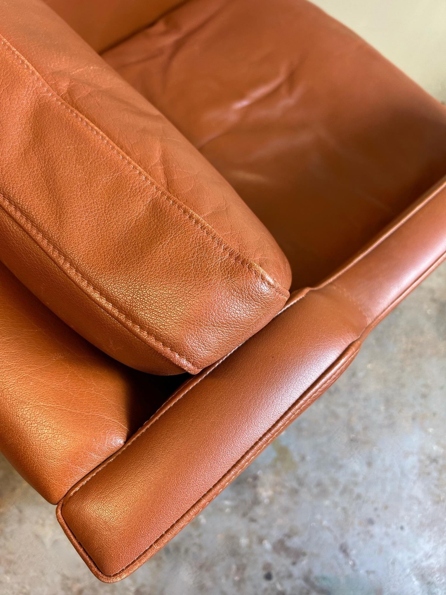 A beautiful Danish tan leather armchair by Stouby, this would make a stylish addition to any living or work area.

The chair has a wide seat and padded backrest for enhanced comfort. A striking piece of classic Scandinavian furniture.

The chair is