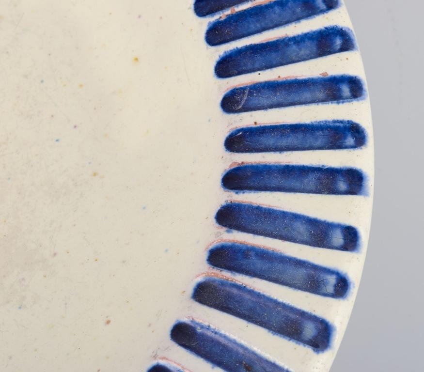 Glazed Danish studio ceramicist. Ceramic bowl with fluted design and blue stripes. For Sale