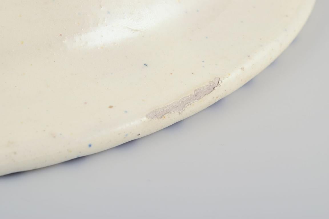 Danish studio ceramicist. Ceramic bowl with fluted design and blue stripes. For Sale 1