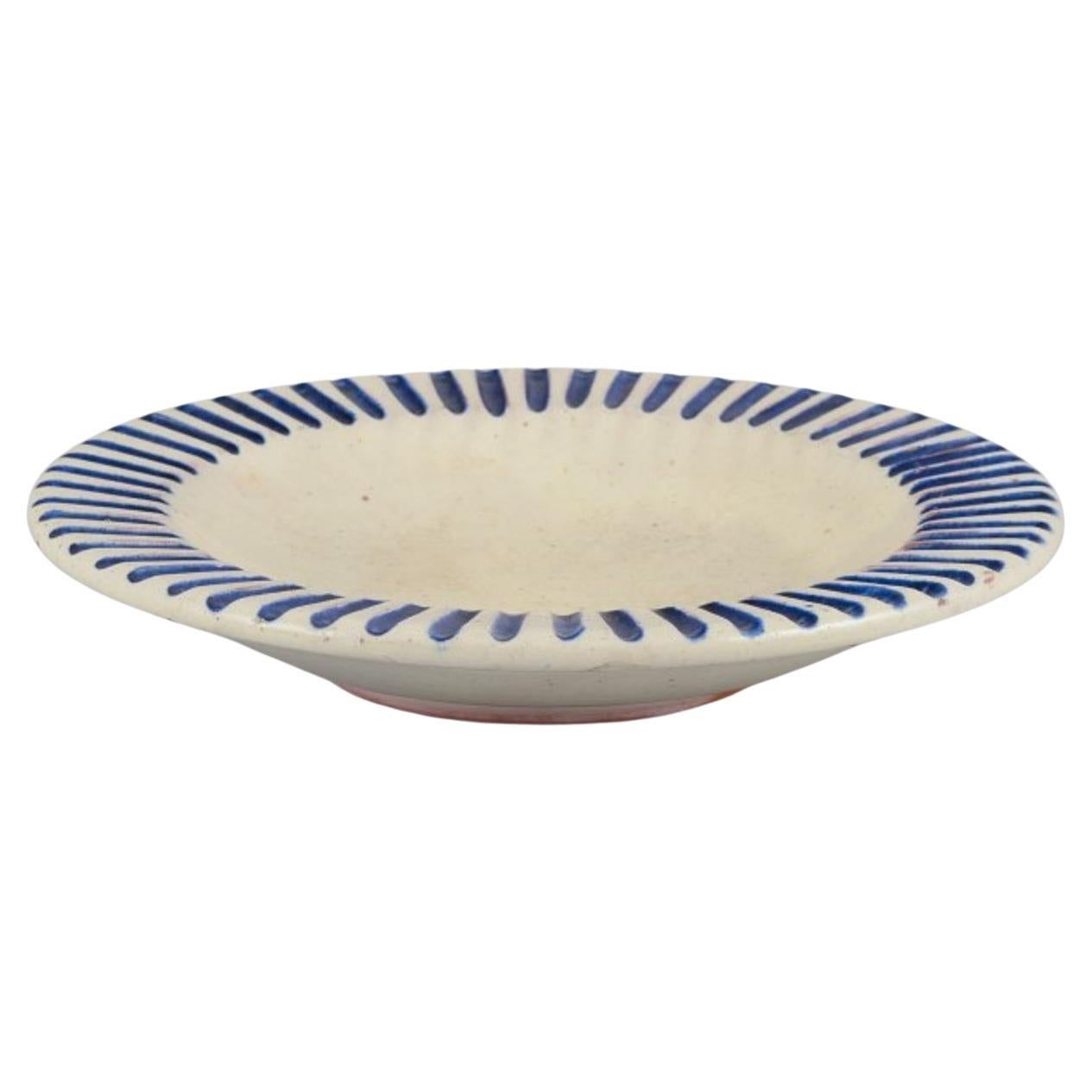 Danish studio ceramicist. Ceramic bowl with fluted design and blue stripes. For Sale