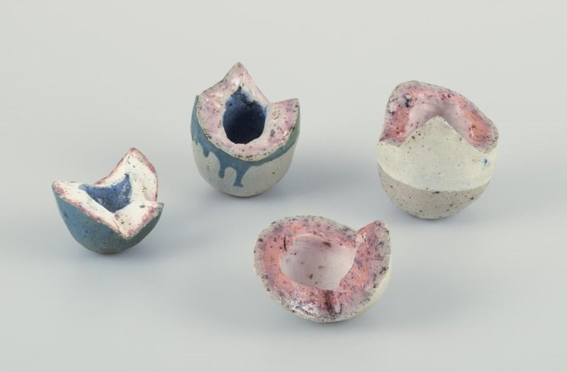 Danish studio ceramicist.
Two egg-shaped unique ceramic sculptures. Divided into two parts.
Around the 1980s.
In excellent condition, the smaller sculpture with minor insignificant chips on the lid.
Glazed in sandy and blue hues.
White one: Height