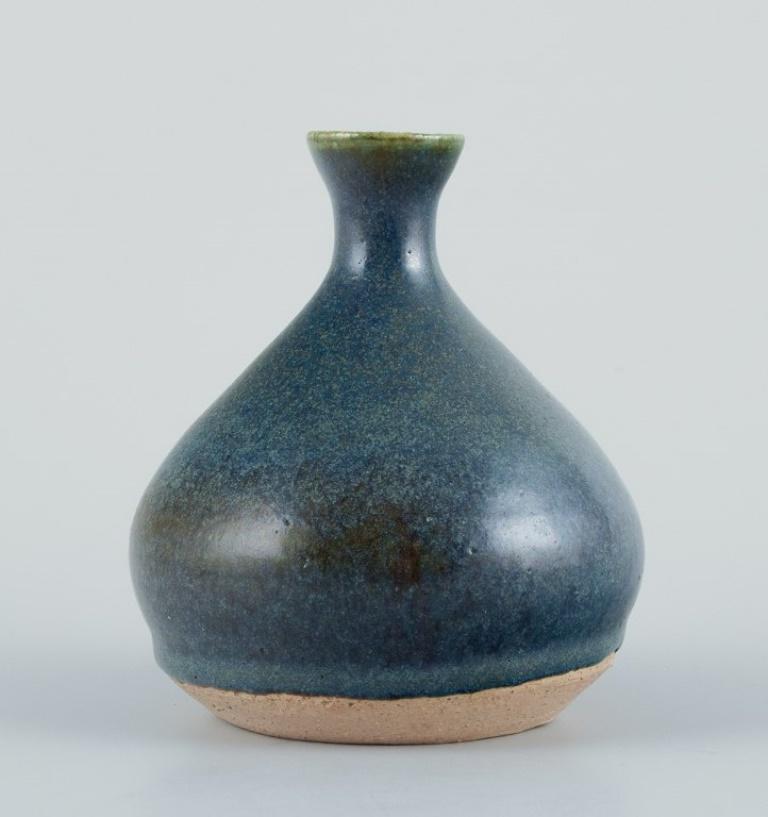 Danish studio ceramist. Unique ceramic vase with blue-toned glaze.
From the 1970s/1980s.
Signed with monogram and 