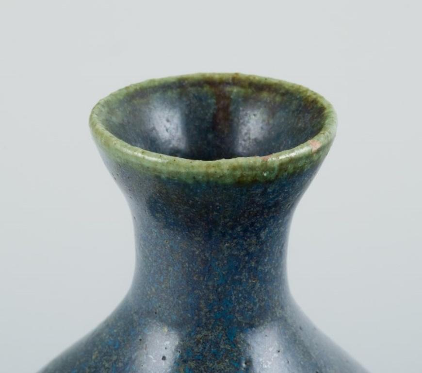 Late 20th Century Danish studio ceramist. Unique ceramic vase with blue-toned glaze. For Sale