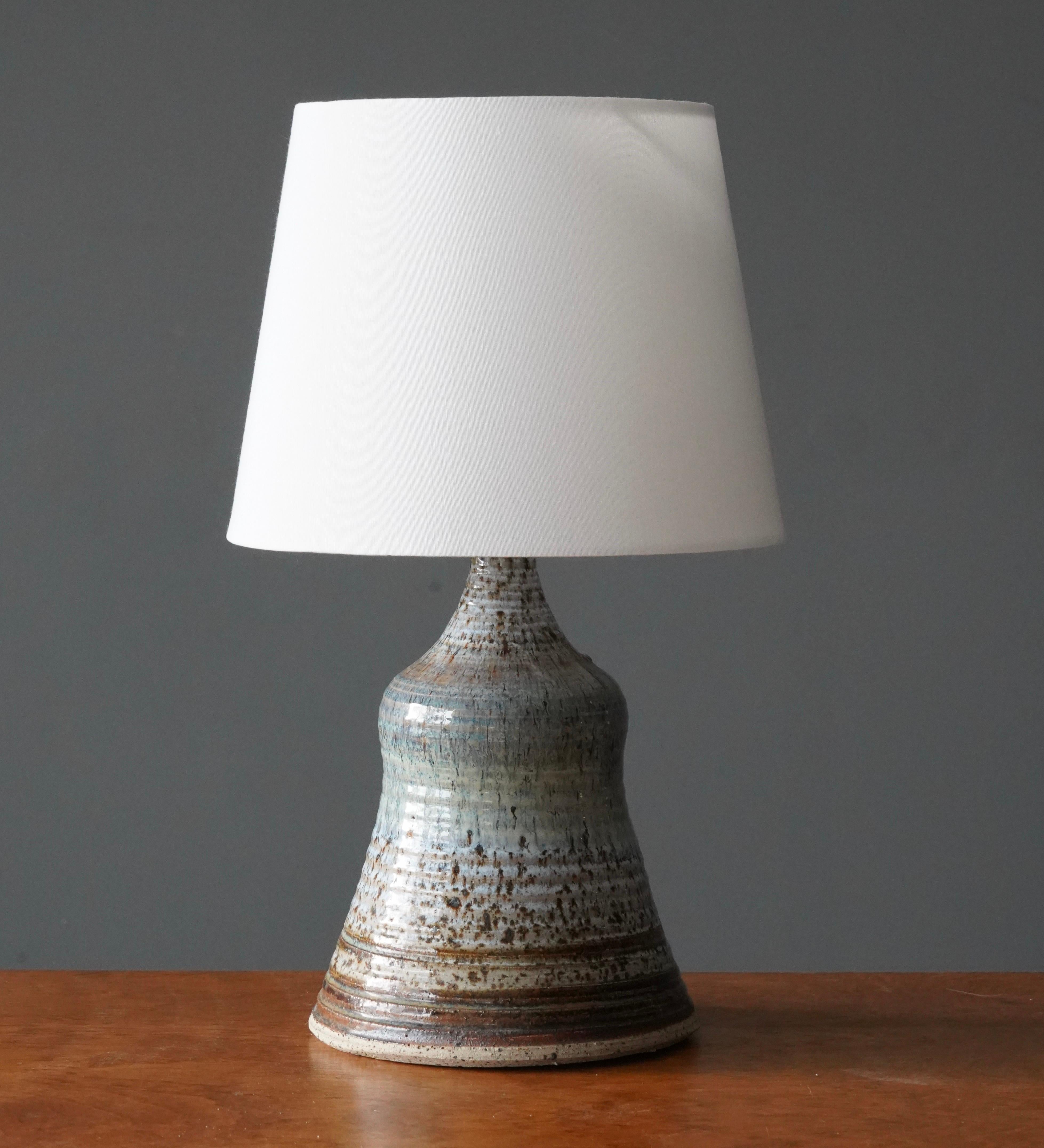 A stoneware table lamp designed and produced by Erik Ove Askholm.

Dimensions listed are without lampshade. 
Dimensions with shade: height is 16.75 inches, width is 10 inches.
Dimensions of shade: top diameter is 7.5 inches, bottom diameter is 10