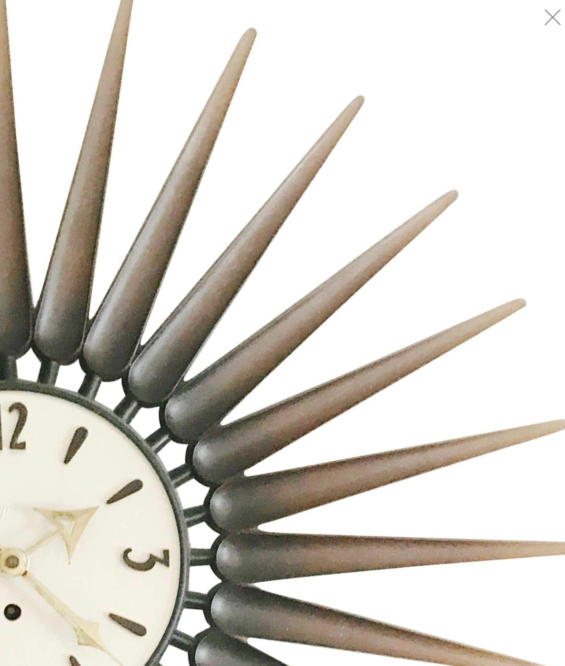 Wonderful Norwegian style starburst clock by Syroco. This Syracuse, NY based company was best known for their molded wood-pulp products that resembled hand-carving, such as this sculptural piece.

The archetypal design makes this clock appropriate