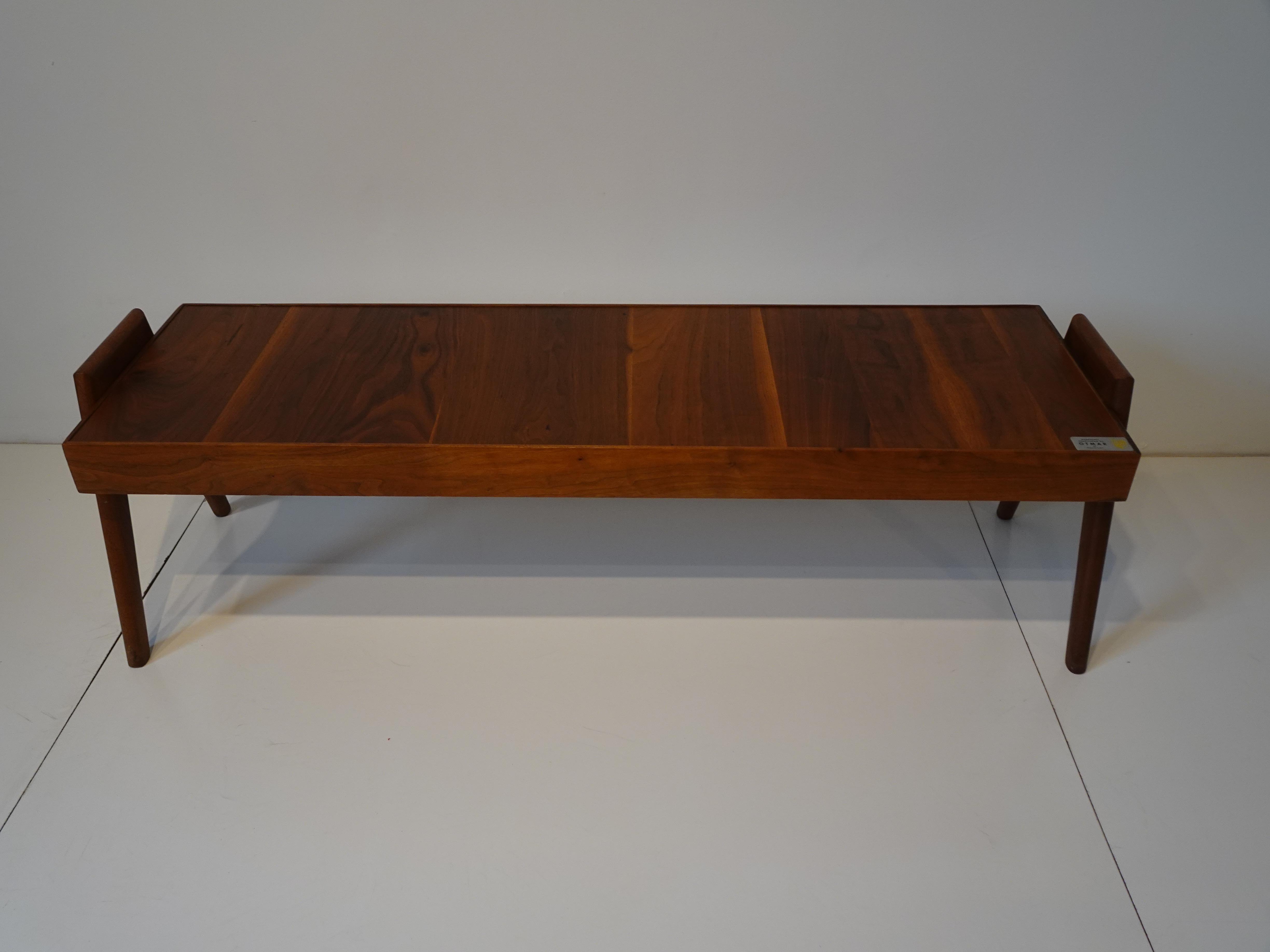 A very well crafted teak wood coffee table with sliding upper top server all sitting on compass styled legs in the manner of Svend Aage Madsen. Retains the manufactures label of a well known Danish furniture craftsman from the Cincinnati area who