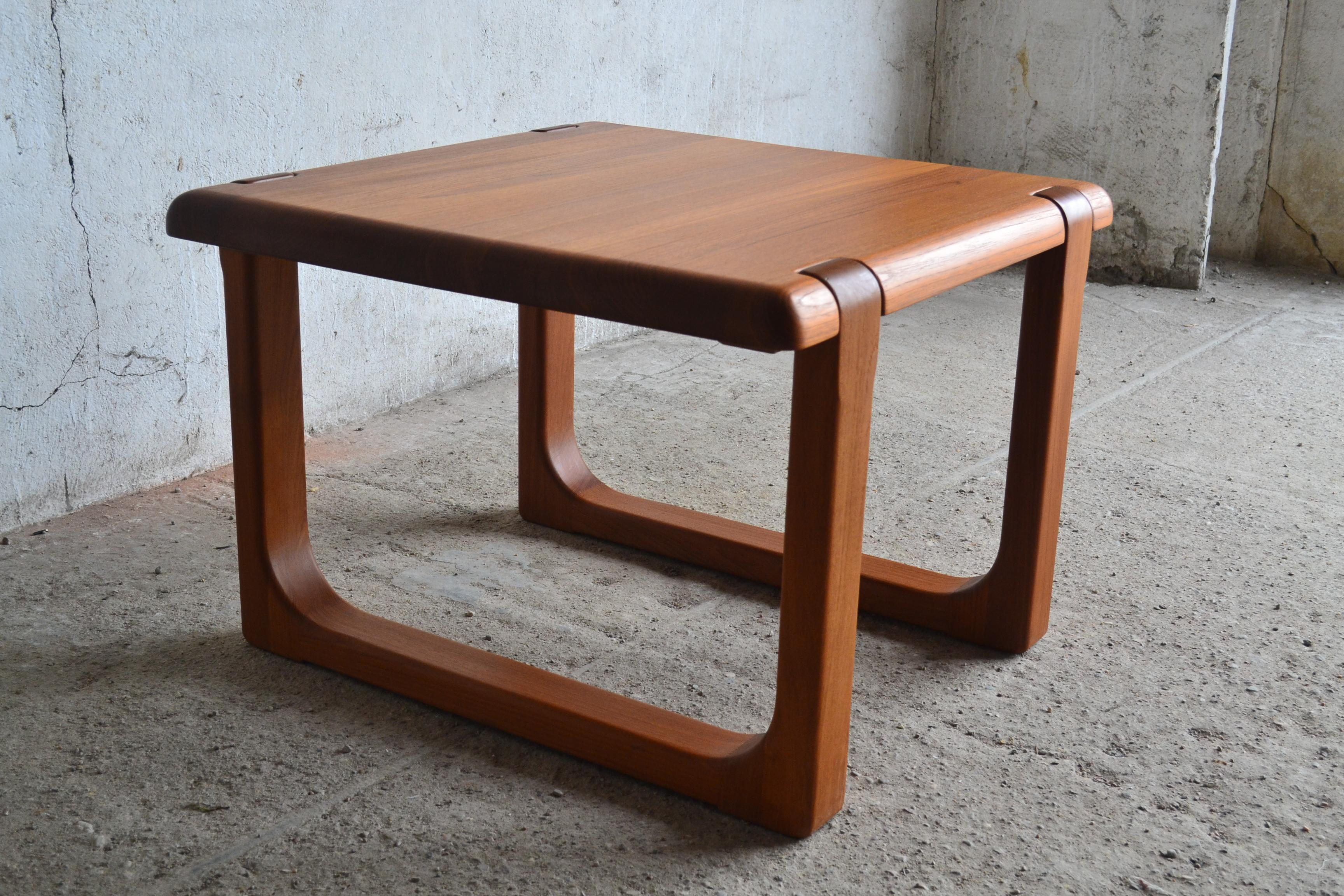 - Danish coffee table by Niels Bach
- Produced in the 1960s
- Made of solid teak wood
- Signed
- Fully original condition with no renovation.