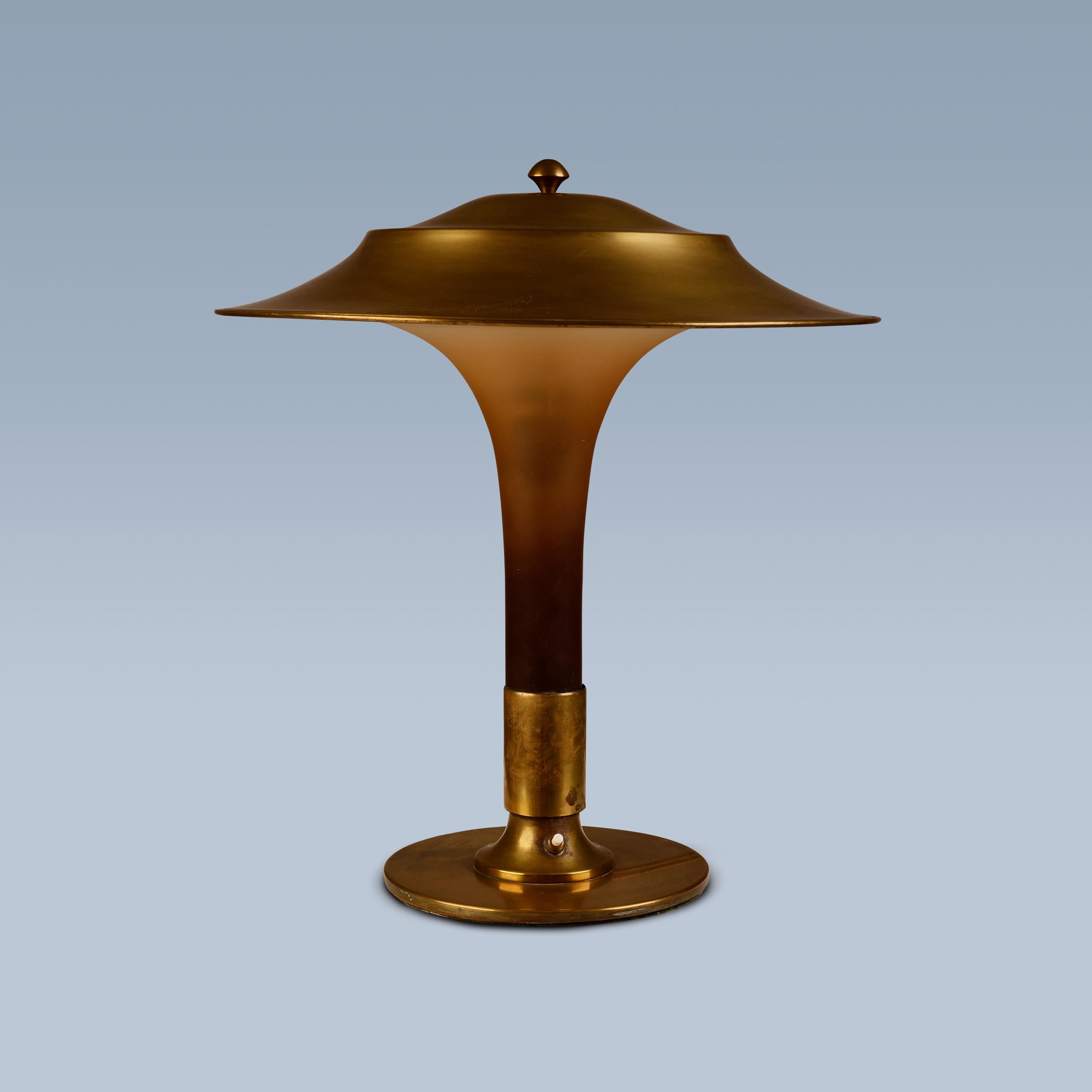 Brass Danish table lamp with brass foot, topshade and matt amber coloured glass stem  For Sale