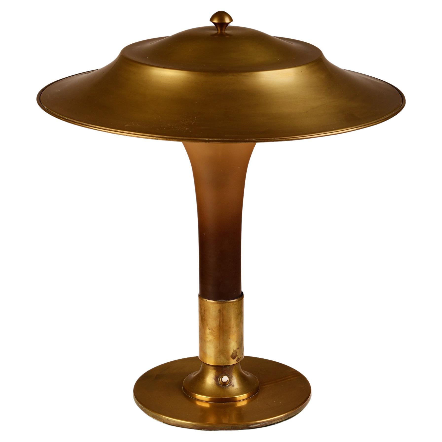 Danish table lamp with brass foot, topshade and matt amber coloured glass stem 