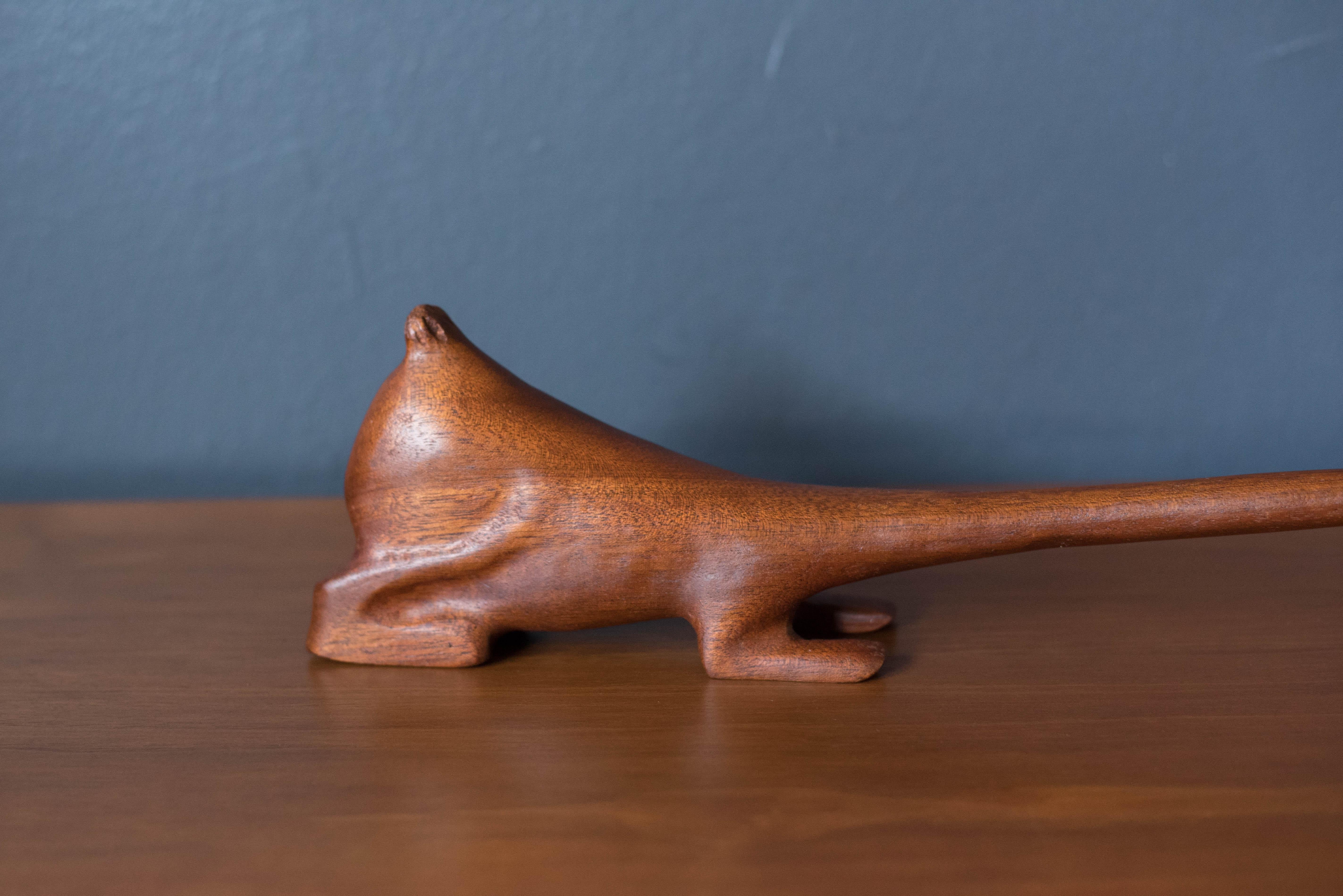 Vintage animated Aardvark sculpture hand carved in teak. Knud Albert was known for using the left over scrap wood from Danish furniture to create his figurines. This abstract animal displays a dramatically long neck with cartoon eyes.