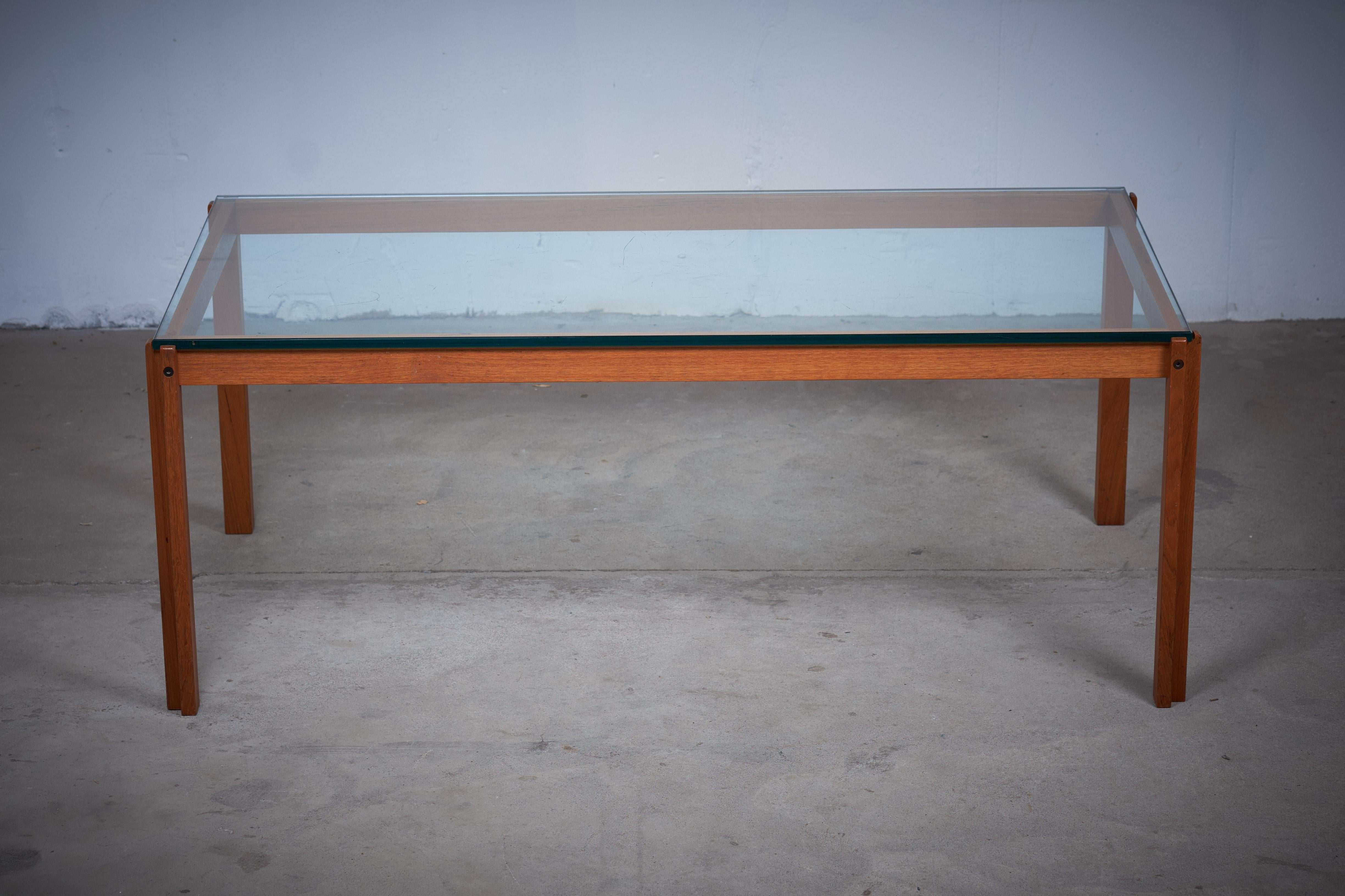 Danish design, coffee table in teak with top in glass from the 1960s.
Very simple but still very beautiful. The table are in good condition, the glass top (which are heavy) has a few scratches.