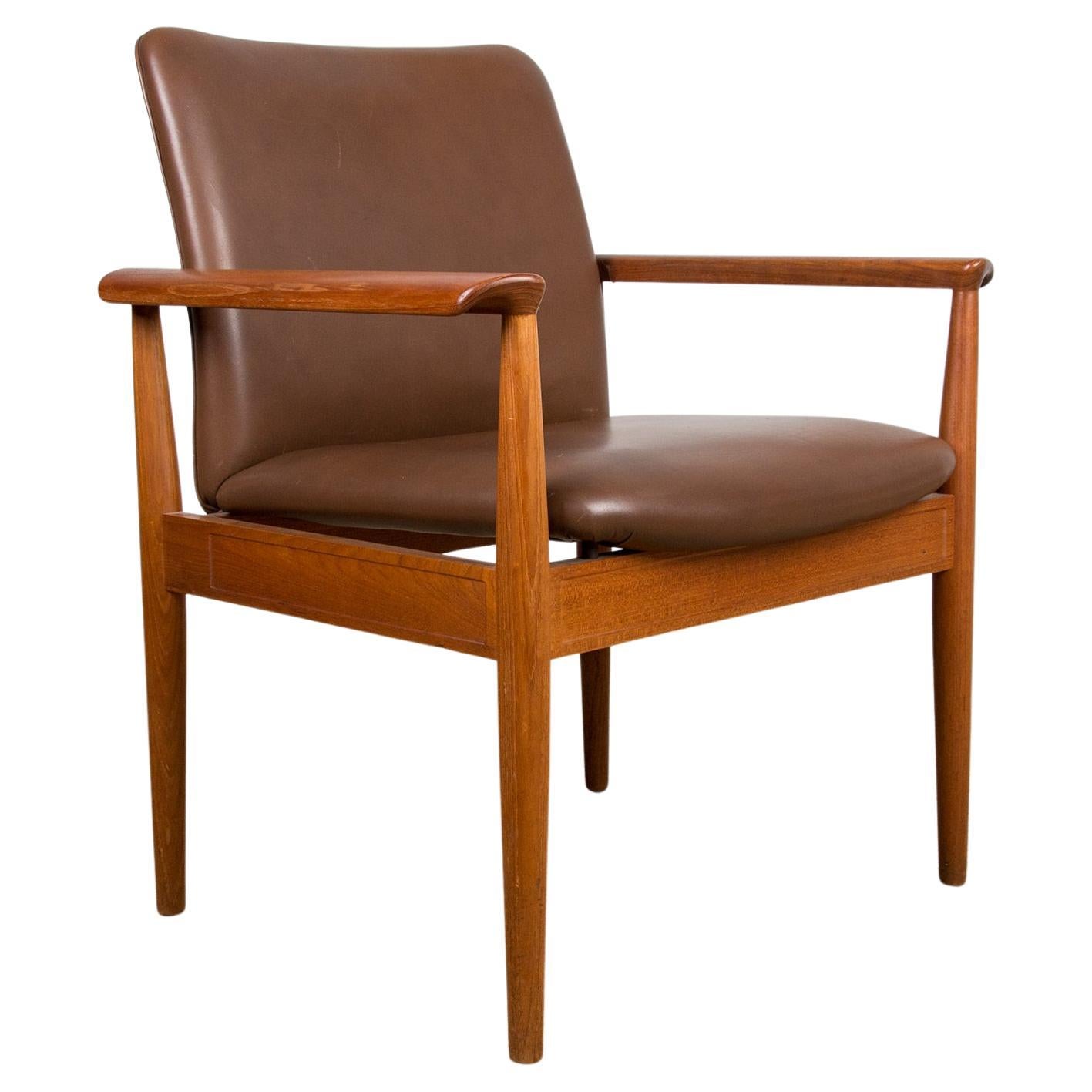 Danish Teak and Leather Armchair Model 209 "Diplomat" by Finn Juhl for Cado. For Sale
