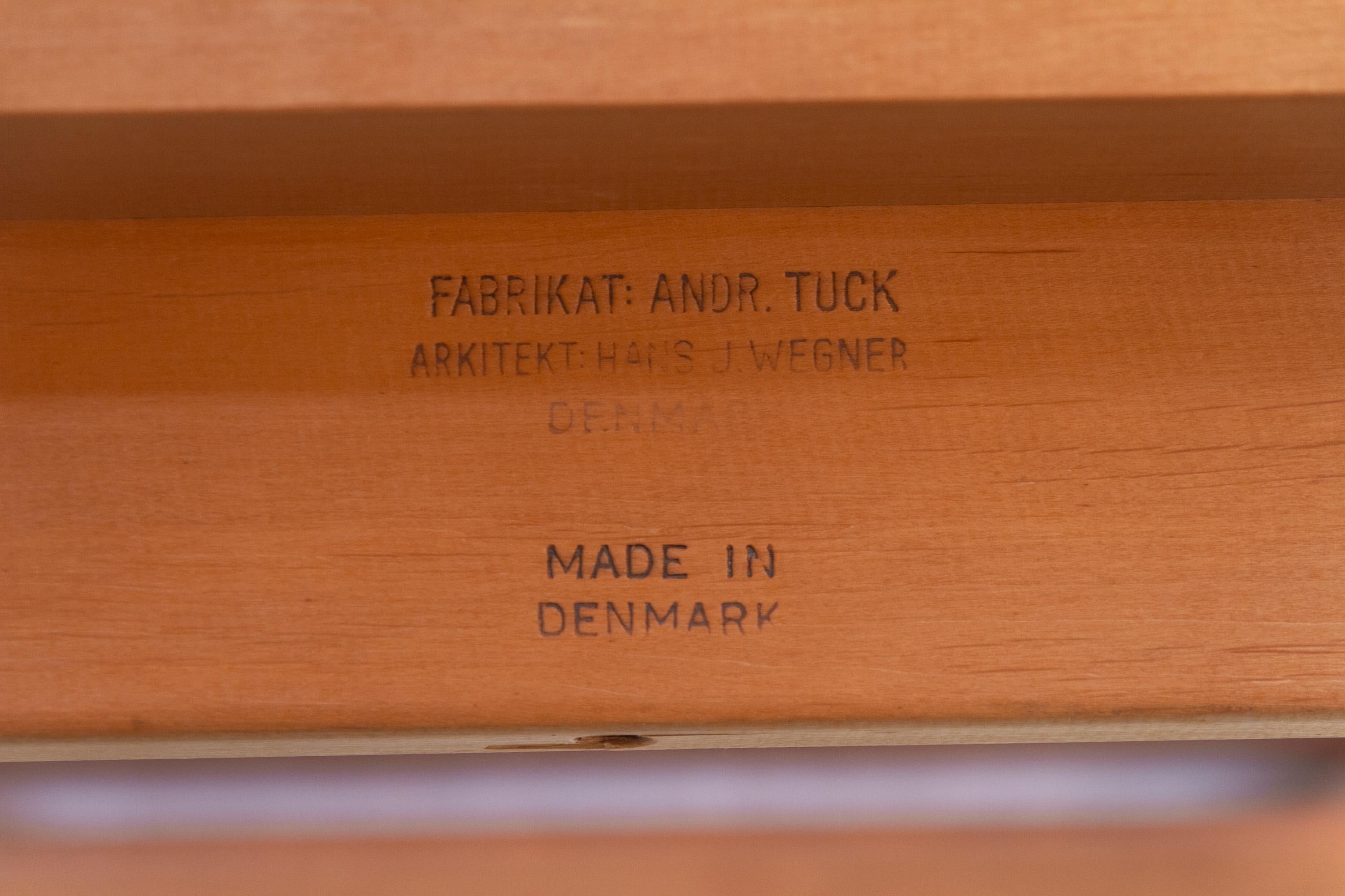 Danish Teak and Oak AT-312 Dining Table by Hans Wegner for Andreas Tuck, 1960s.

Lovely Scandinavian Mid-Century Modern Model AT 312 dining table with frame and legs in solid Nordic oak. Table top including extension leaves in teak. 
Designed by