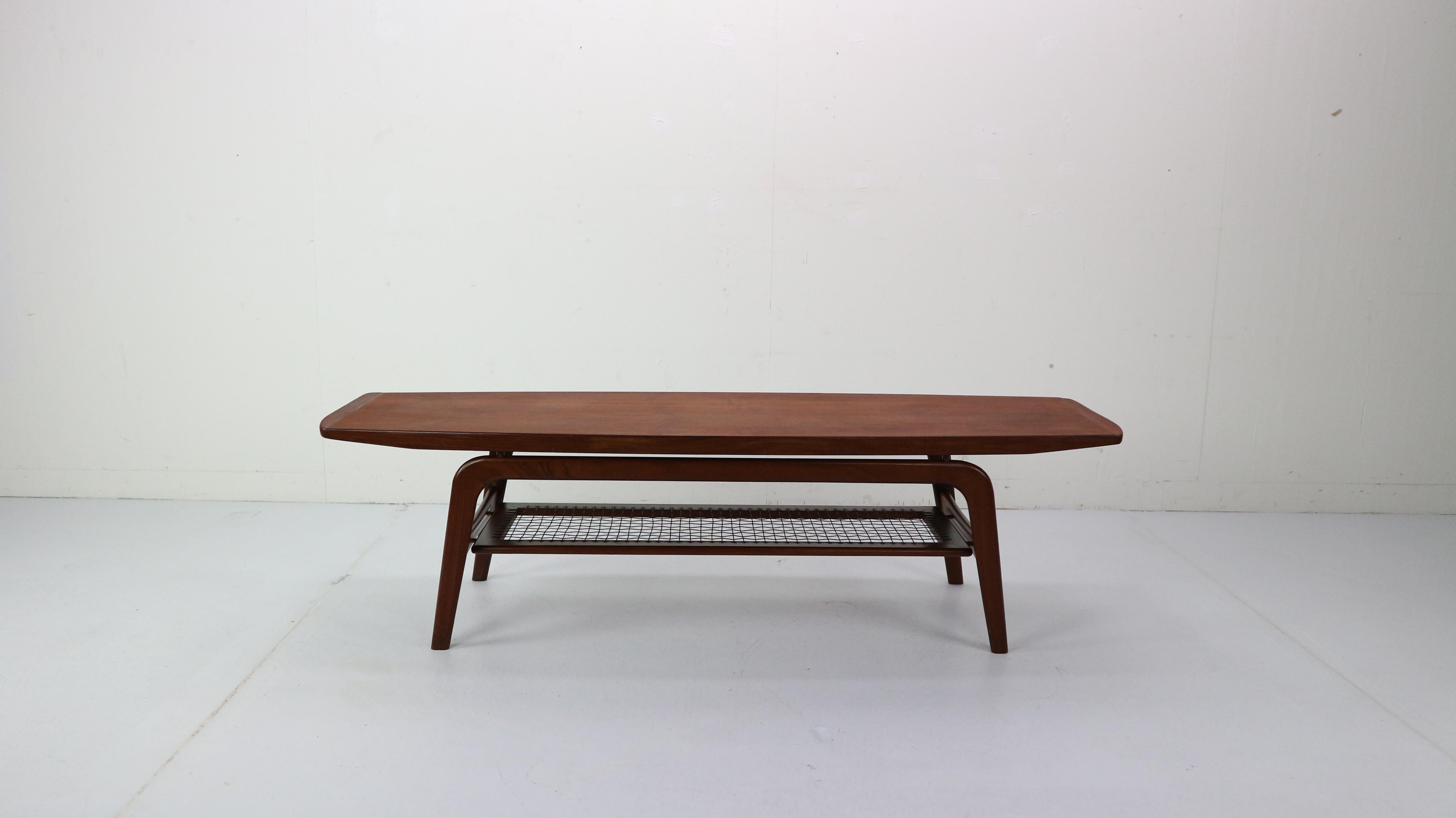 This Danish design pride teak wooden table is designed by famous Danish furniture designer Arne Hovmand-Olsen and manufactured by Mogens Koch in circa 1960s.

Arne Hovmand-Olsen's work is always marked by beautiful lines and sculptural shapes.