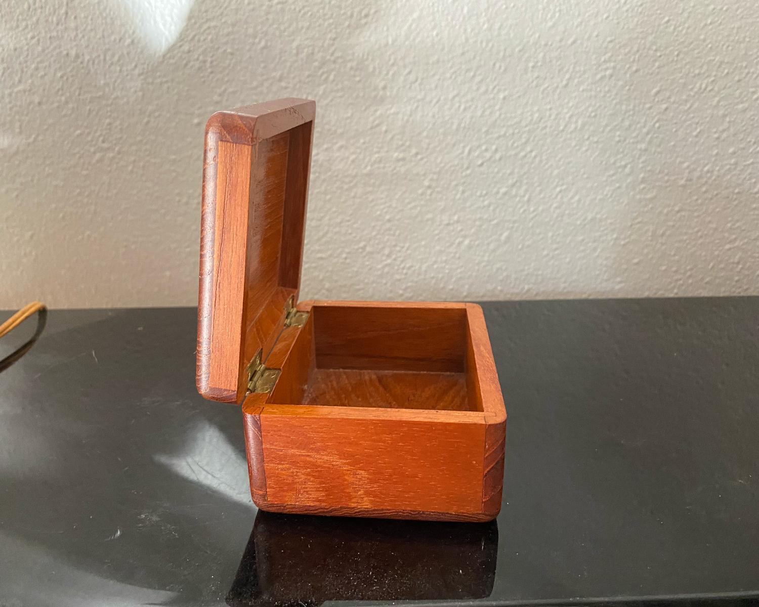 wig hanging out of trunk