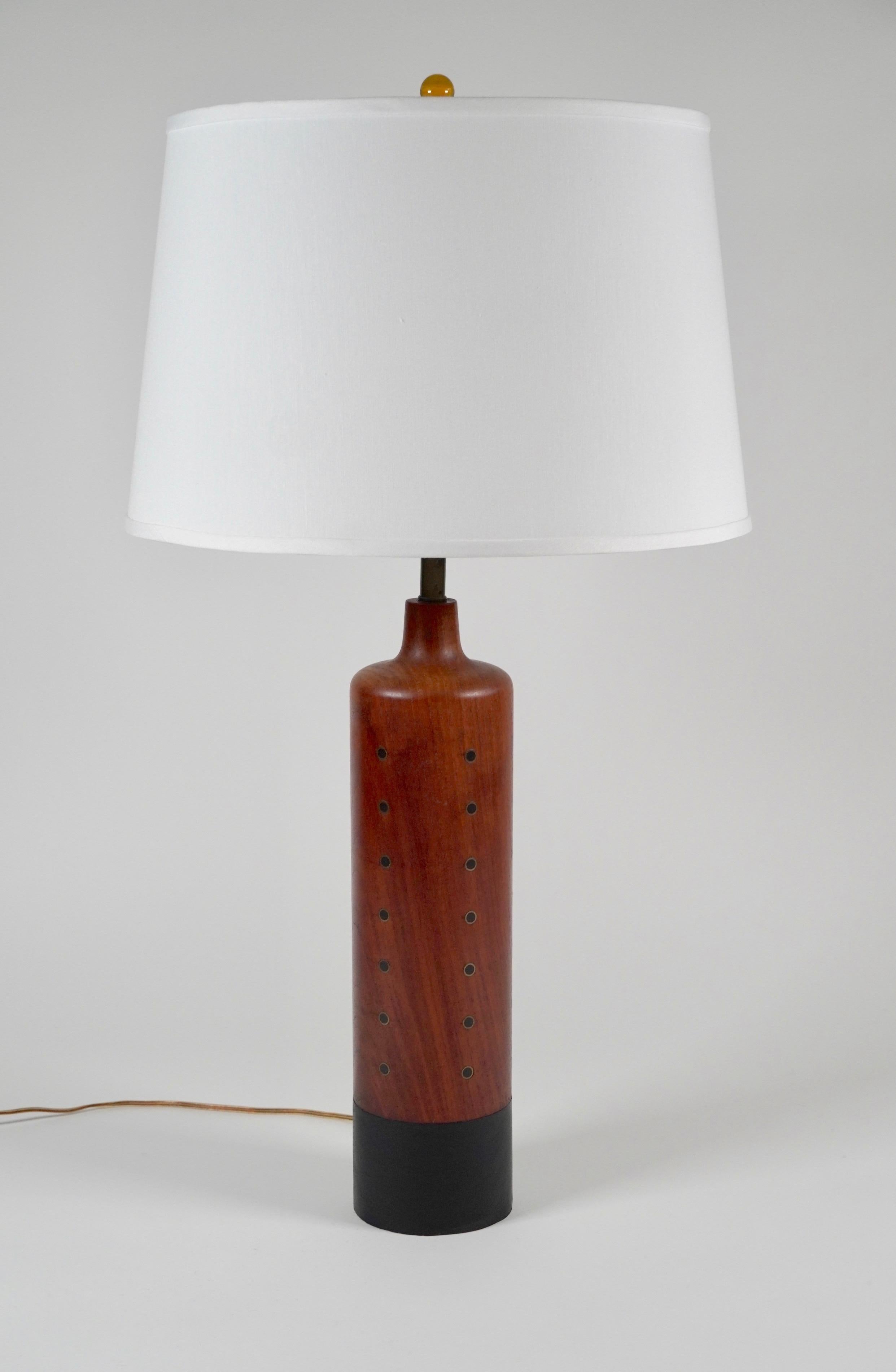 Turned solid teak table lamp with brass and ebony inlay and a leather wrapped base. Created by H. Passke of Denmark circa 1960s with an rich color to the teak and a soft patina to the brass. Marked on the bottom of base H. Passke Denmark.