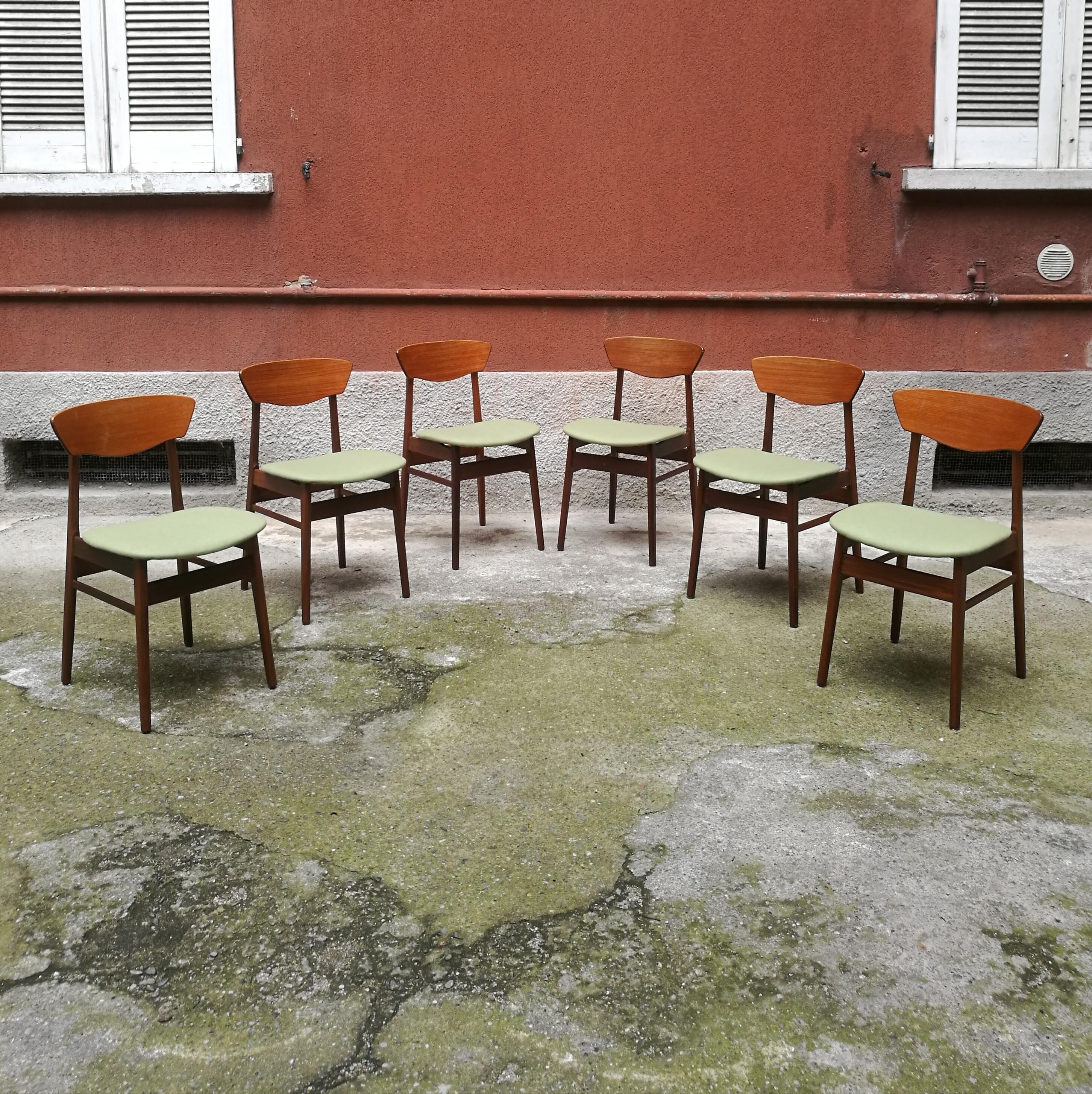 Danish teak chairs with green seats from 1960s
Superb set of six chairs from 1960s, made in Denmark. Lighter teak on the back and darker on the legs, while the seat as been upholstered and covered with a light green fabric. The curved structure of