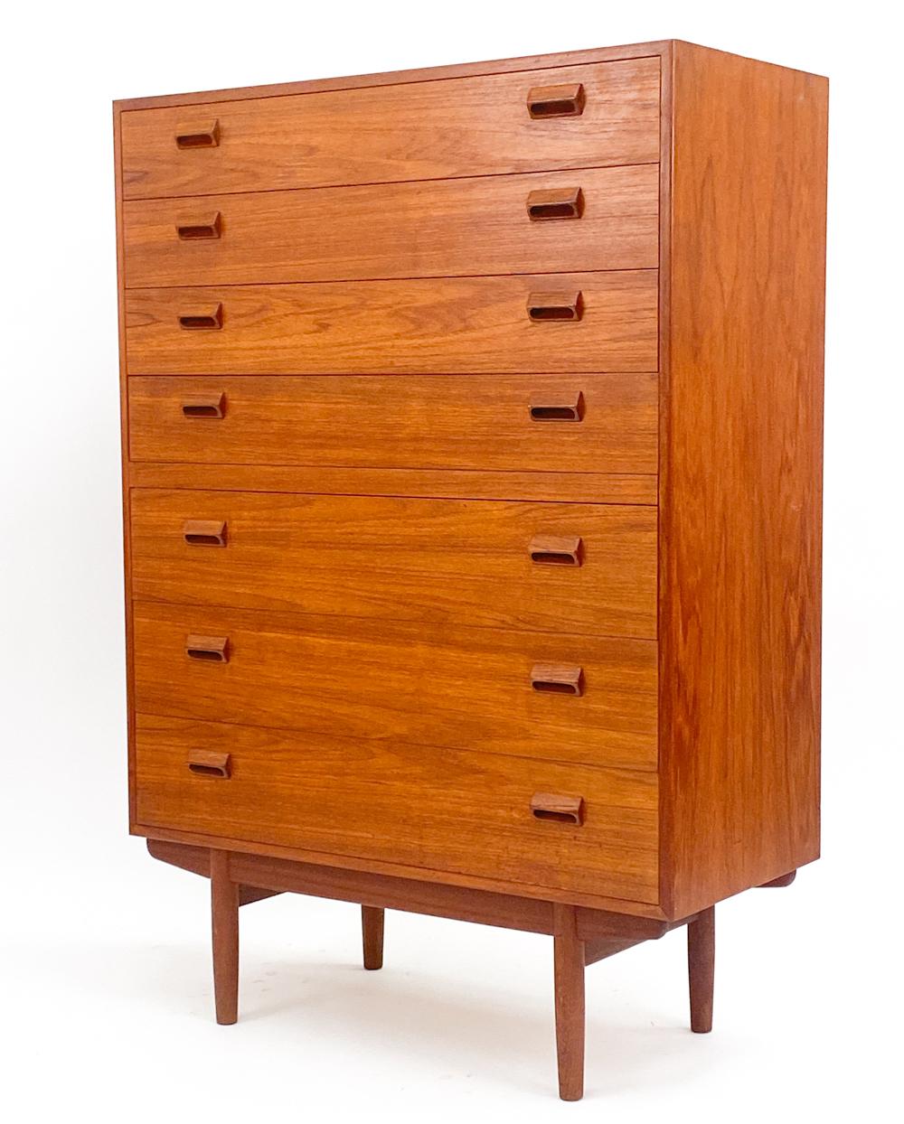 This beautiful teak chest of drawers was designed by the notable Borge Mogensen. This piece was manufactured for Soborg sometime around the 1950's. It is an iconic example of the mid-century modern style, contrasting clean lines with intriguing