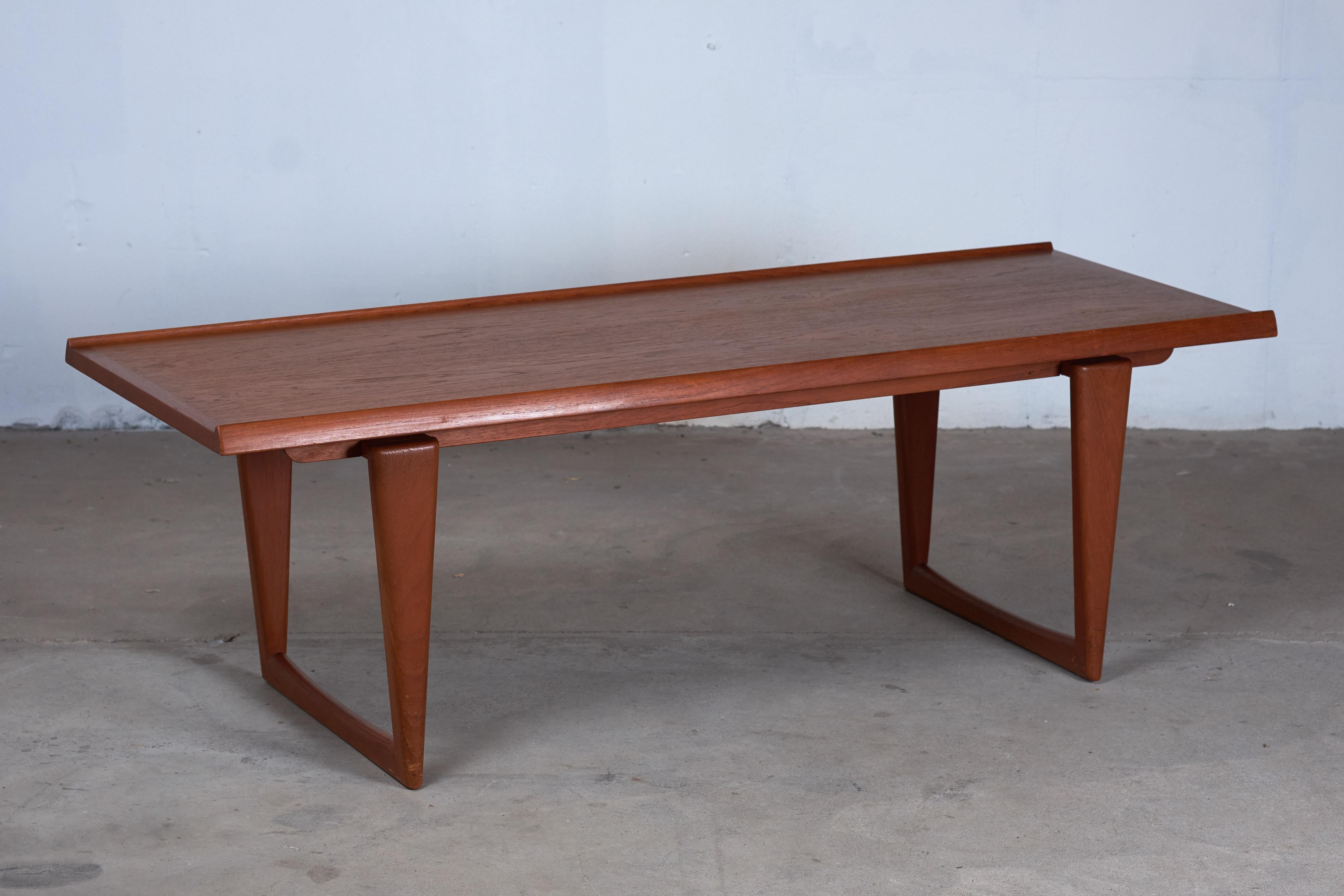 Lovely coffee table in teak, produced in Denmark, circa 1960s.
Features, a raised edge on both sides and is in a very good vintage condition.
The table would suit virtually any modern living environment.