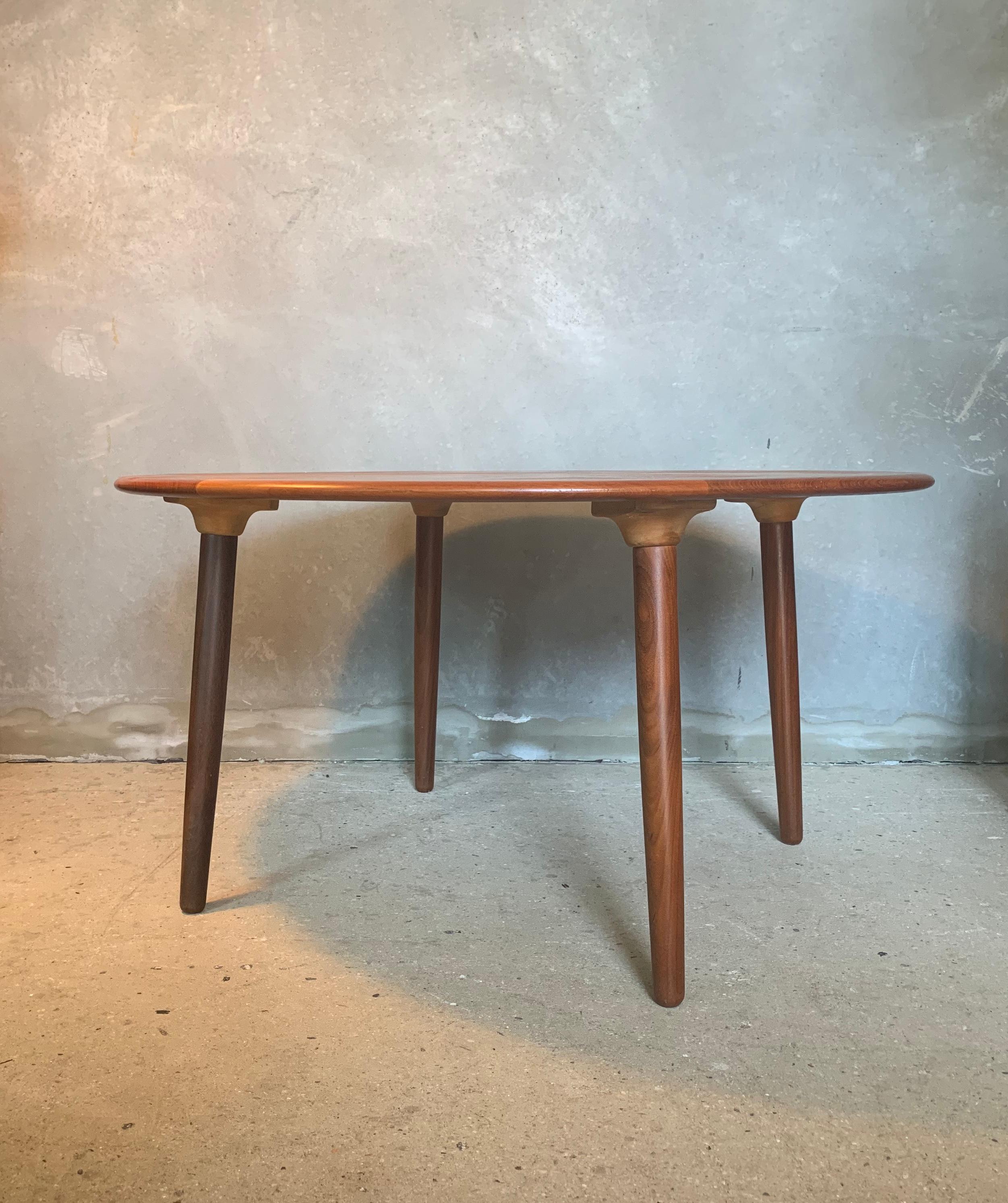 A round four-legged coffee table with a three-tone solid teak diamond design top by H. W. Klein for Bramin, Denmark, 1960s.
 