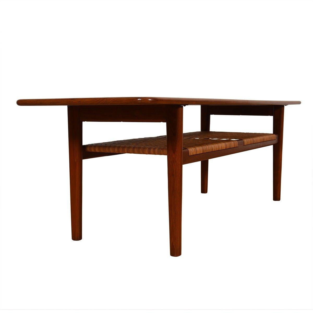 Danish Teak Coffee Table thru Illums Bolighus by Hans Wegner for Andreas Tuck 

Additional information:
Material: Teak
This is the Model AT-10 Table by Hans Wegner for Andreas Tuck. With beautiful lines and proportions, a long length of teak