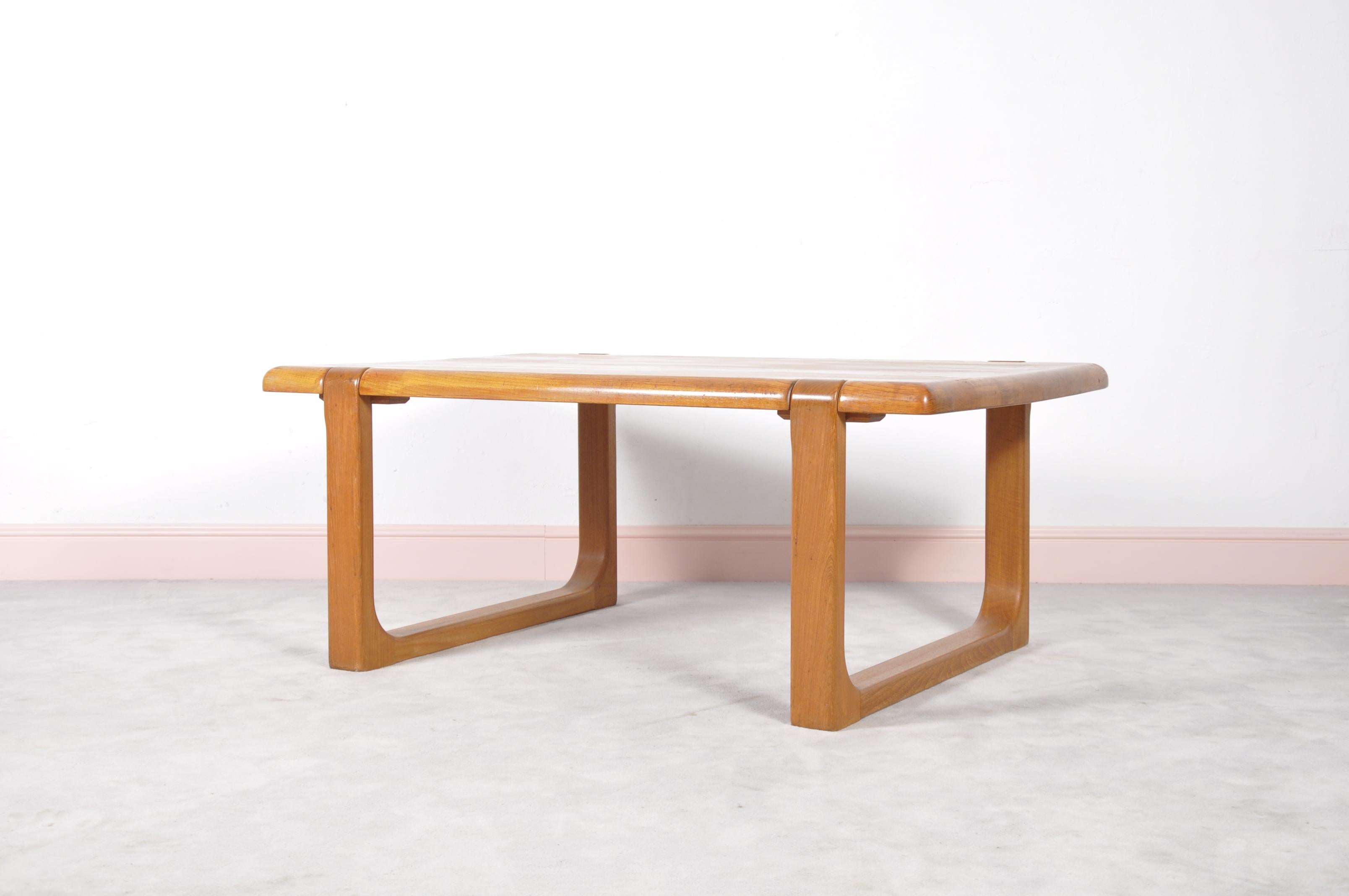 This coffee table was designed by Niels Bach and was produced in Denmark. It is made from solid teak and is in good vintage condition.