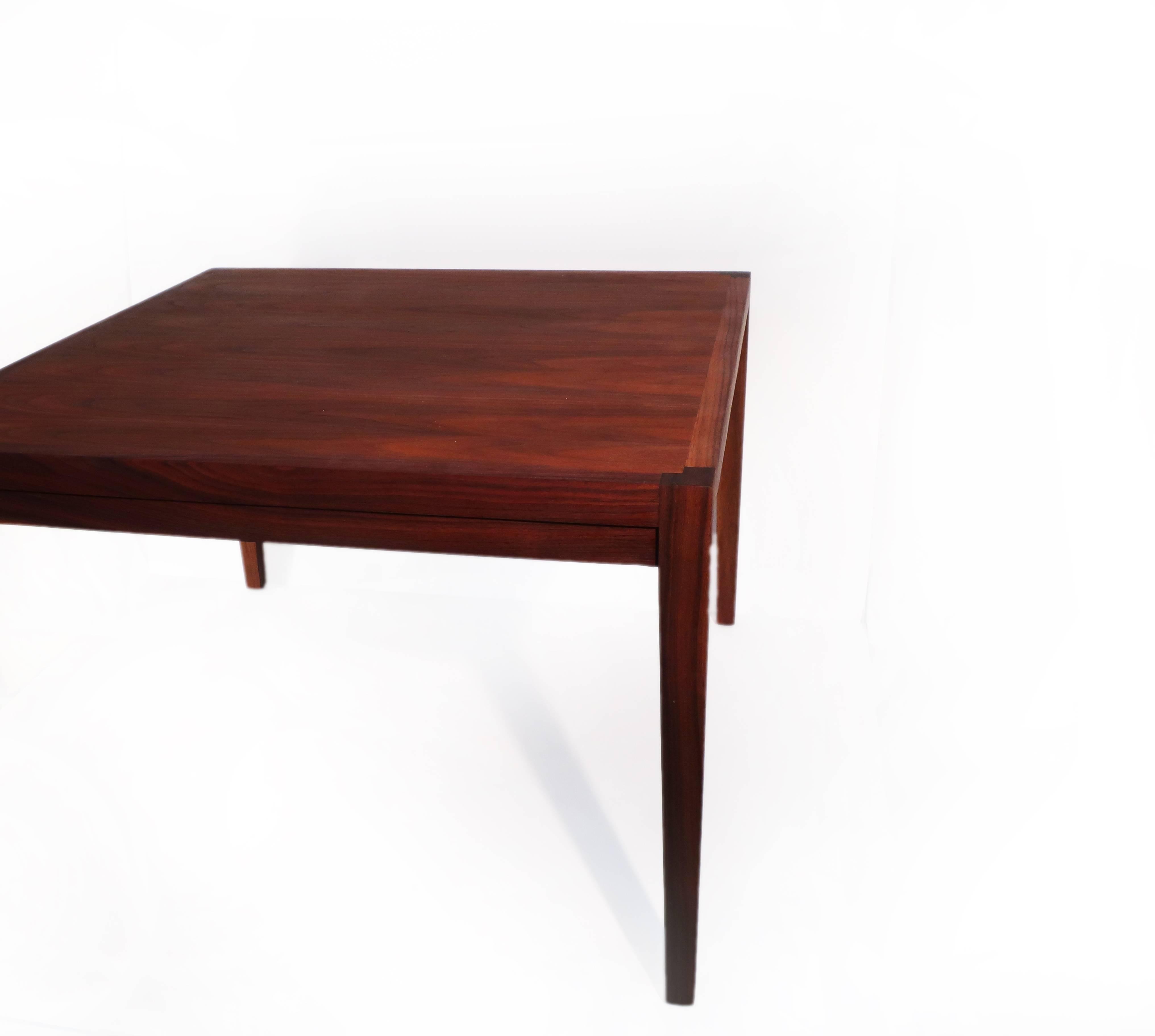 This Danish square teak coffee table has a beautiful grain across the top and lovely contrasting end grain corners. It has recently been refinished to return it to the beautiful shape it was in at the beginning of its life. This table is