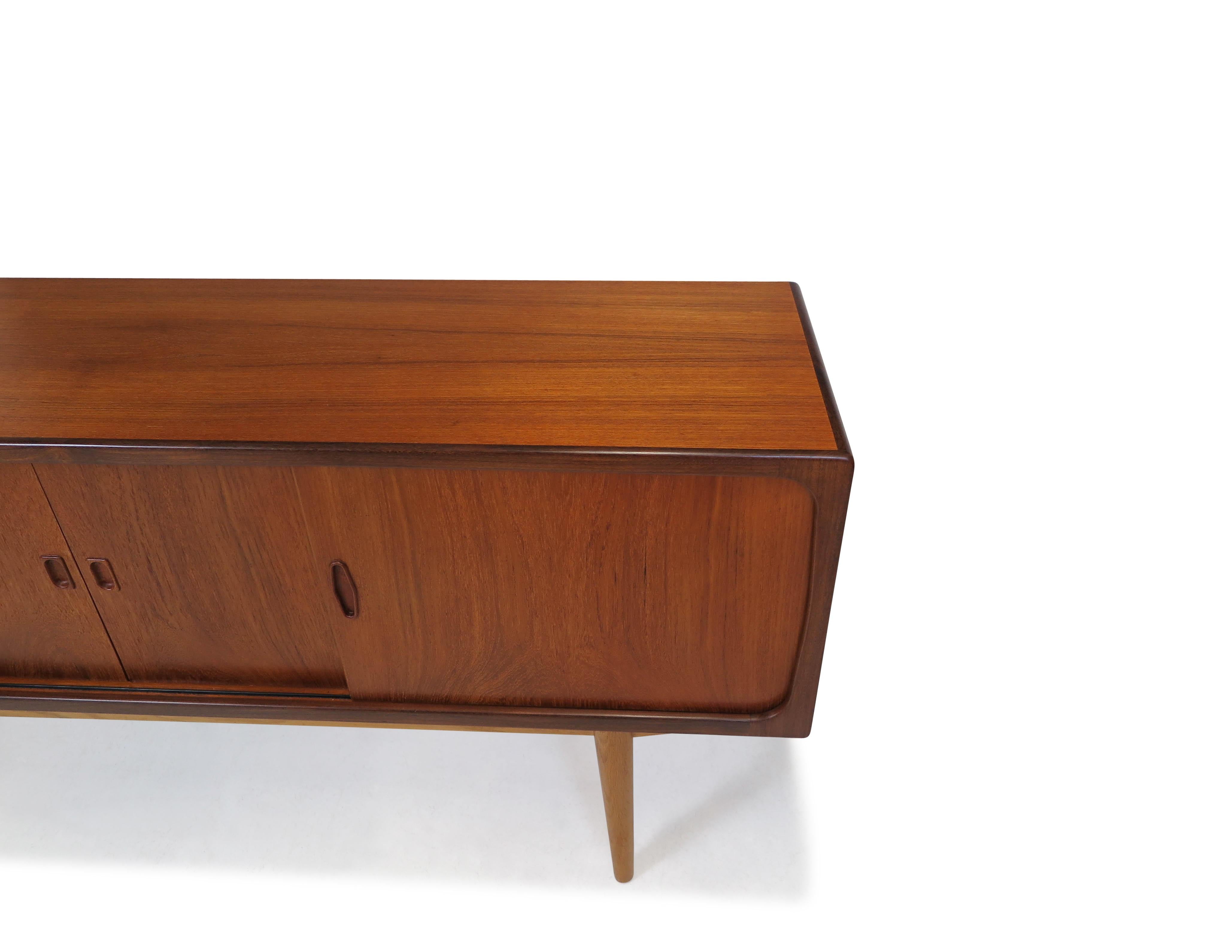 Oiled Danish Teak Credenza with Center Mirrored Bar For Sale