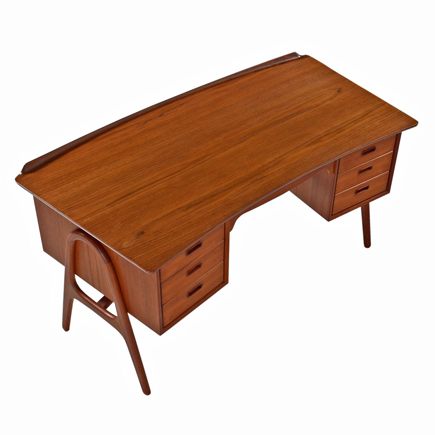 Teak desk imported by Moreddi, circa 1960. Moreddi worked with a variety of Danish designers and manufacturers to import and wholesale Danish design in the 1950s and 1960s. This desk was designed by Svend Madsen. 

Svend Aage Madsen designed this