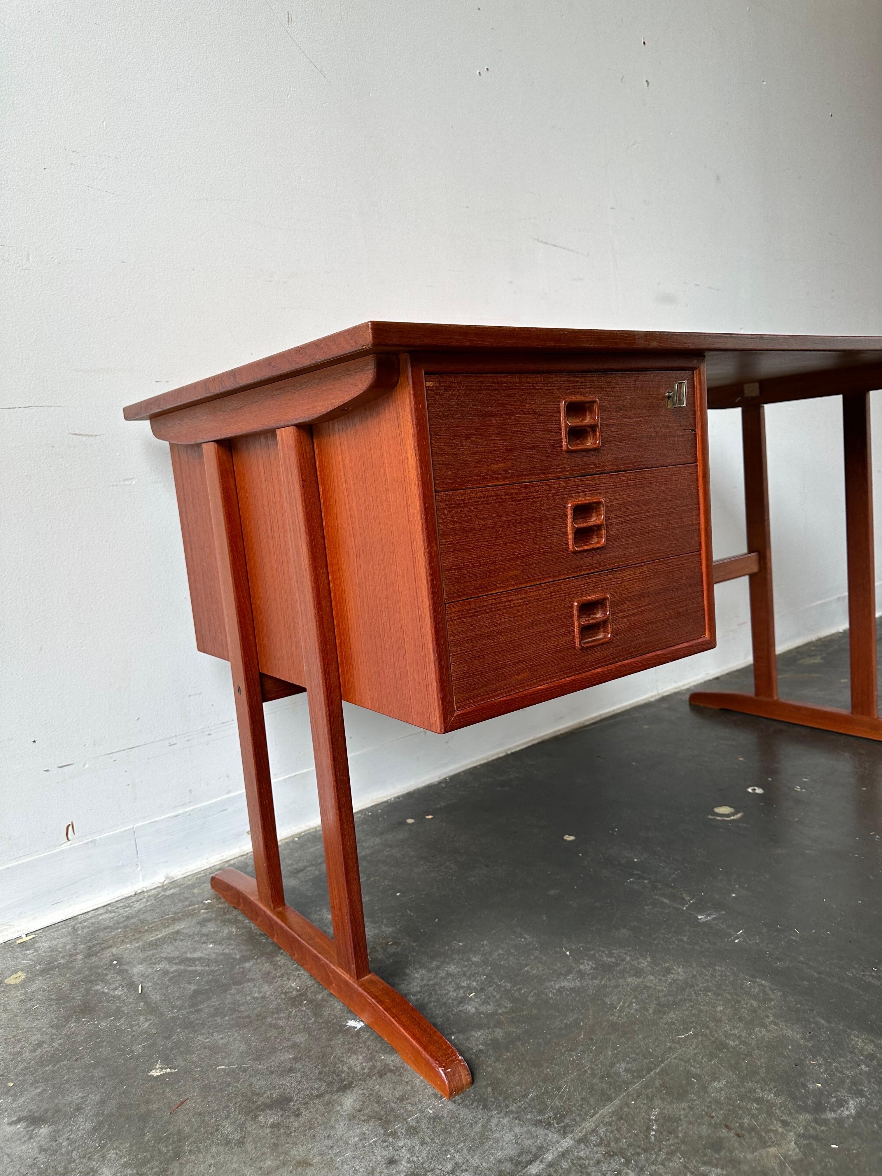 Mid-20th Century Danish teak desk with open bookcase back in the style of Arne Vodder 