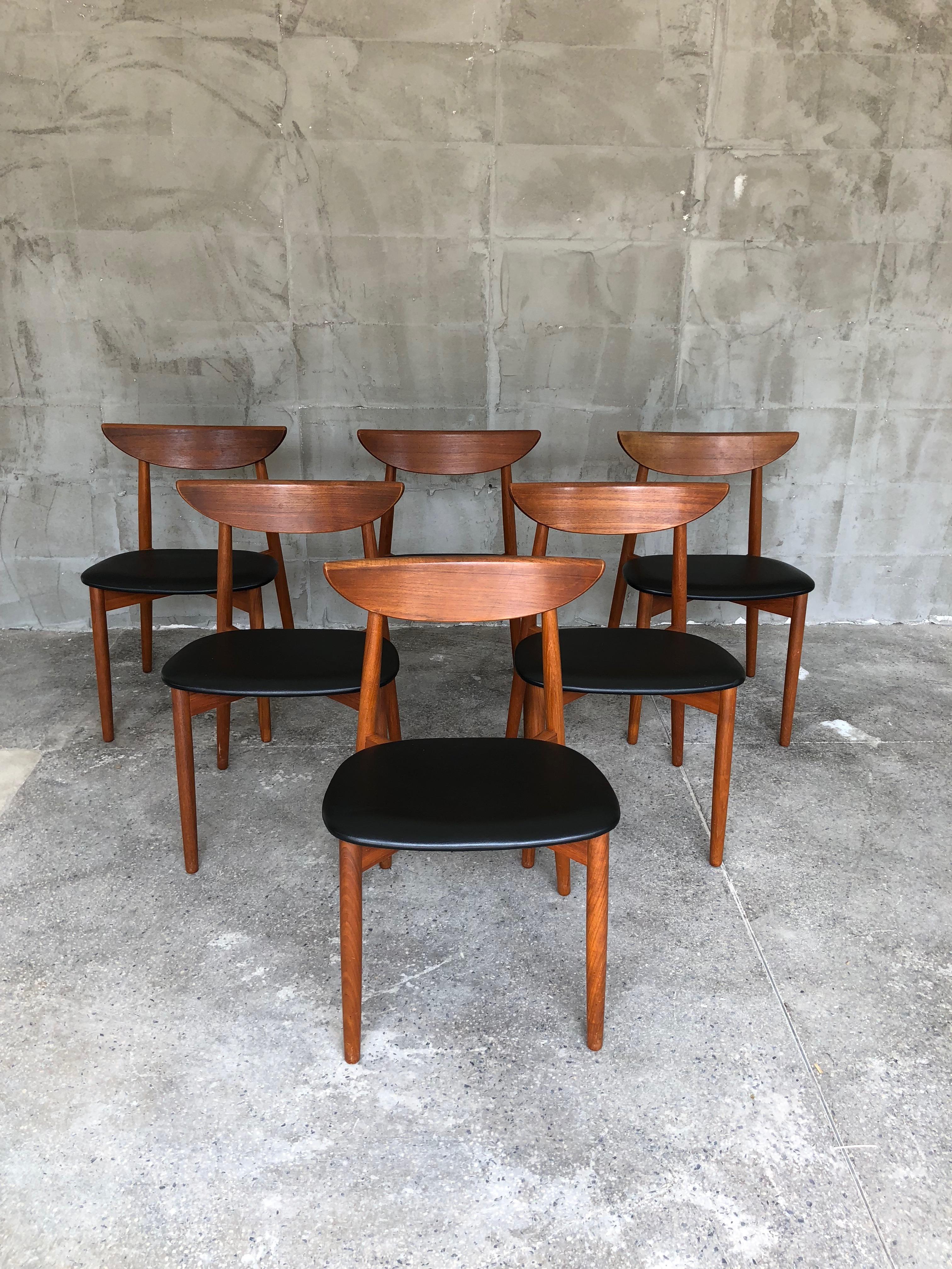 This very stylish and elegant set of six Danish dining chairs by Harry Ostergaard was produced in Denmark in the 1960s. The chairs are stamped under below. This really comfortable chairs have remarkable design. The seats are from black skai.