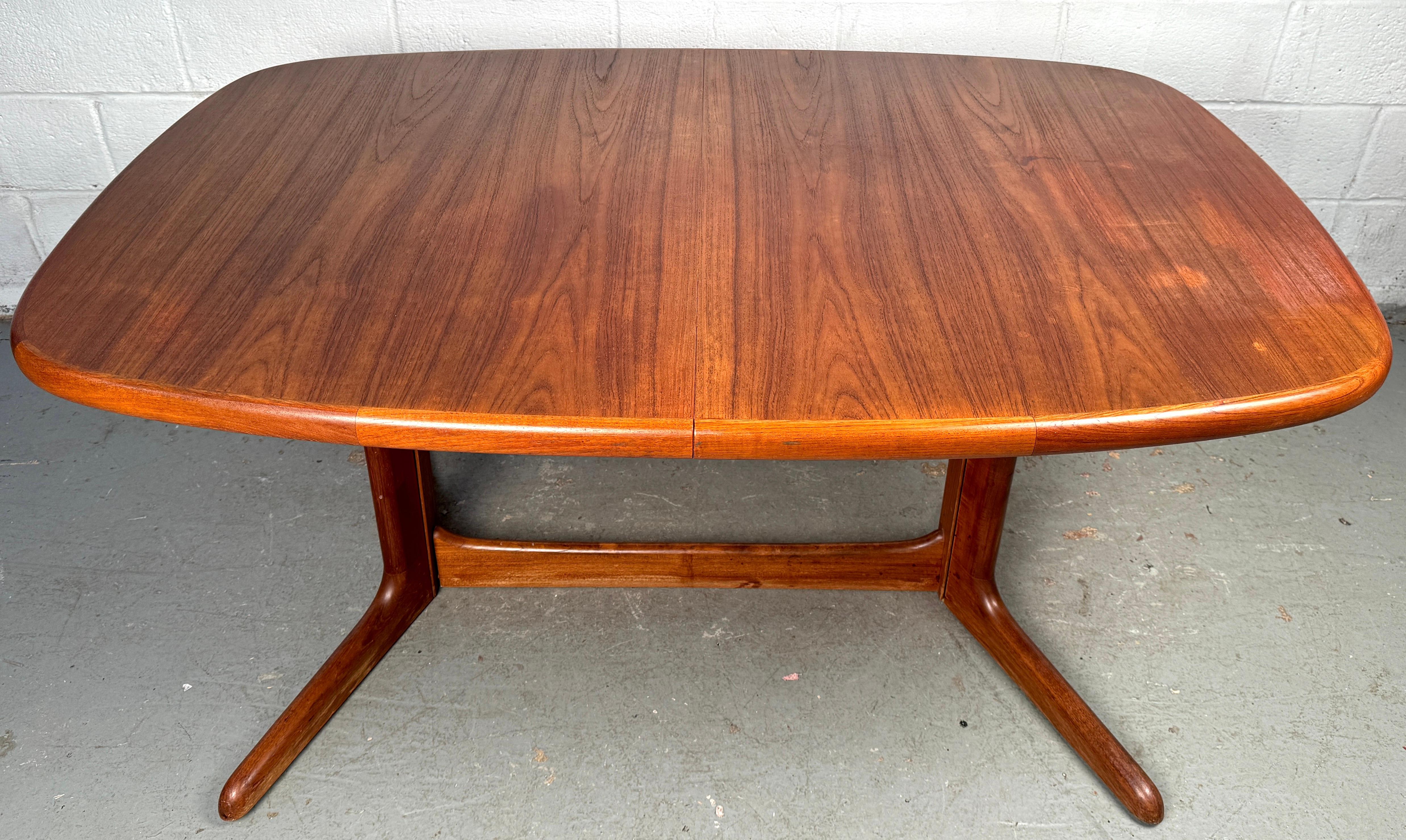 Beautifully crafted mid-century teak table by Rasmus, a stunning example of Scandinavian modern design. Known for their dedication to quality and clean aesthetics, Rasmus produced pieces that emphasize both functionality and elegance—and this table