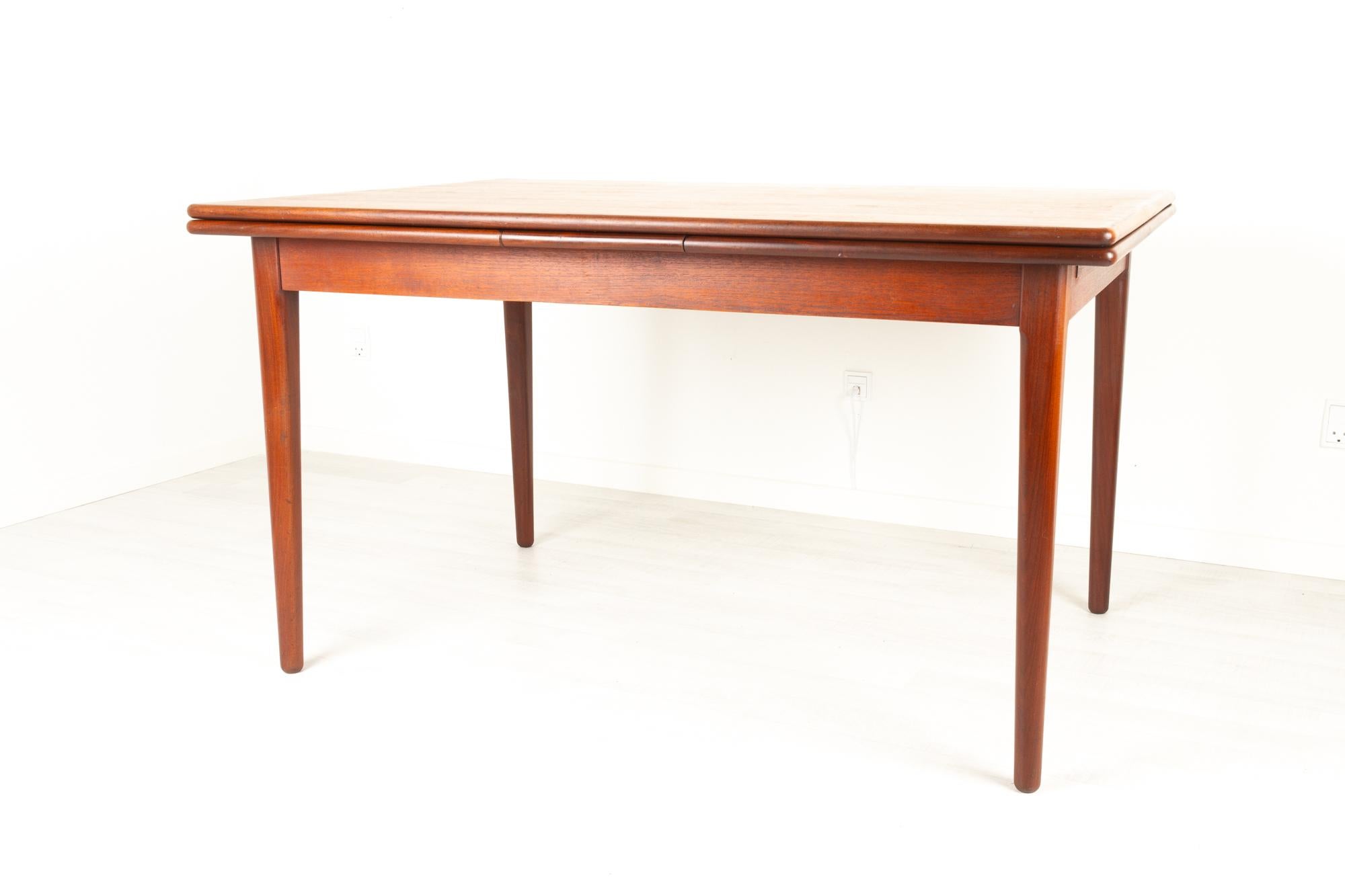 Danish teak dining table, 1960s
Vintage Danish modern extendable dining table. Two draw out extension leaves. Rounded tapered legs with beautiful profile. Very good hand built quality. 
Table extends to 237 cm. Leaves pull out very smooth and