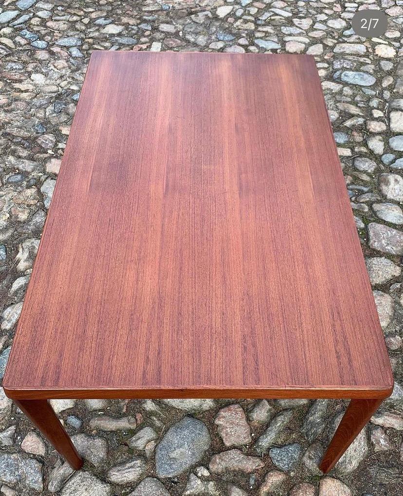 Beautiful and classic teak dining table designed by Henning Kjærnulf and produced in 1960s at Vejle Stole- & Møbelfabrik. Rectangular top with two extension leaves, who increasing the seating capacity. Meaasures: H: 74 cm, W: 90 cm, L: 140/240 cm.