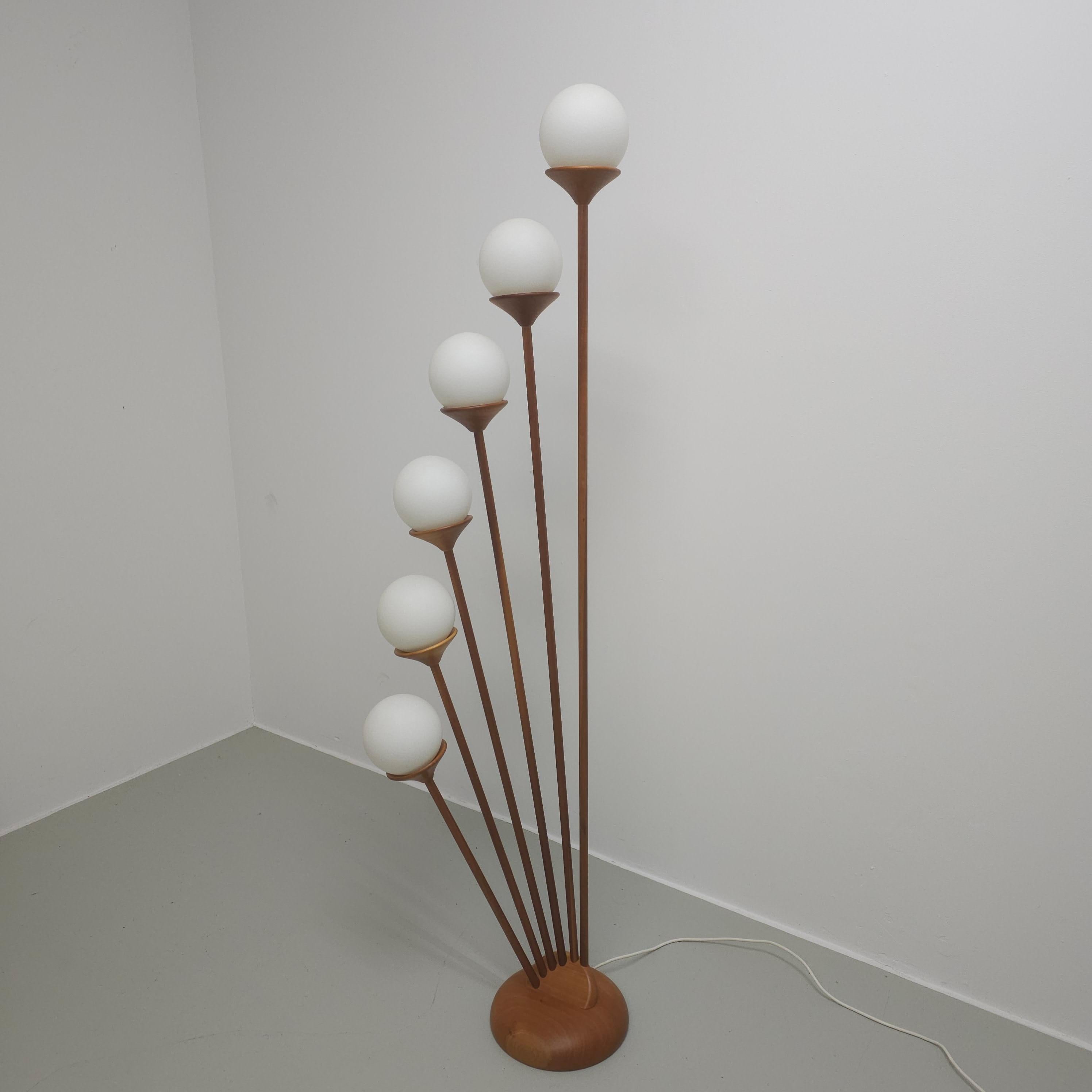 Mid-century wooden teak 'cascade' floor lamp by Danish manufacturer Domus. Unmarked. In a lovely vintage condition. Almost no signs of use. 
Each lamp has a 25 watt light bulb in it in the picture. 