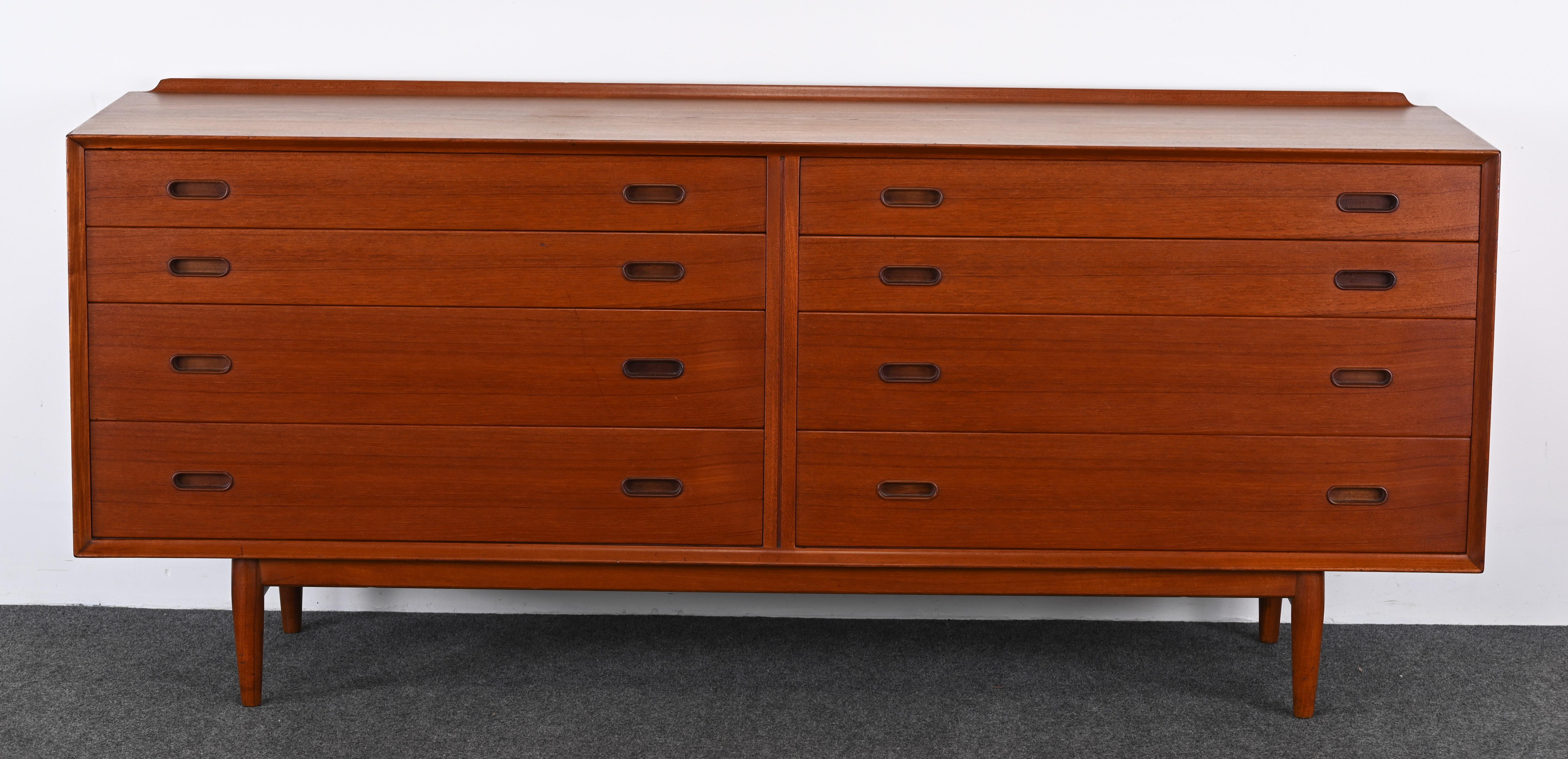 A rare danish teak dresser by Arne Vodder for Sibast Mobelfabrik, 1950s. This elegant Danish Modern eight-drawer double dresser is in very good condition. Would look great in any Mid-Century Modern home or apartment. Very well made and beautifully