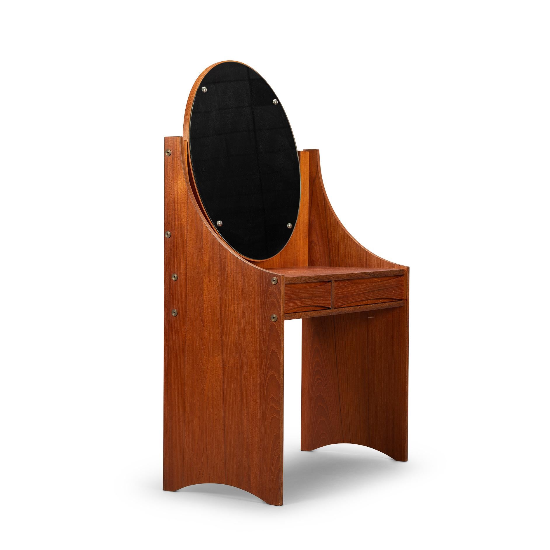 Danish design vanity that will love you.?This Danish beauty is made in teak veneer and design by Arne Vodder for Sibast. The mirror of this vanity is oval shaped and suspended from the elegant legs of the vanity. The drawers are of different sizes